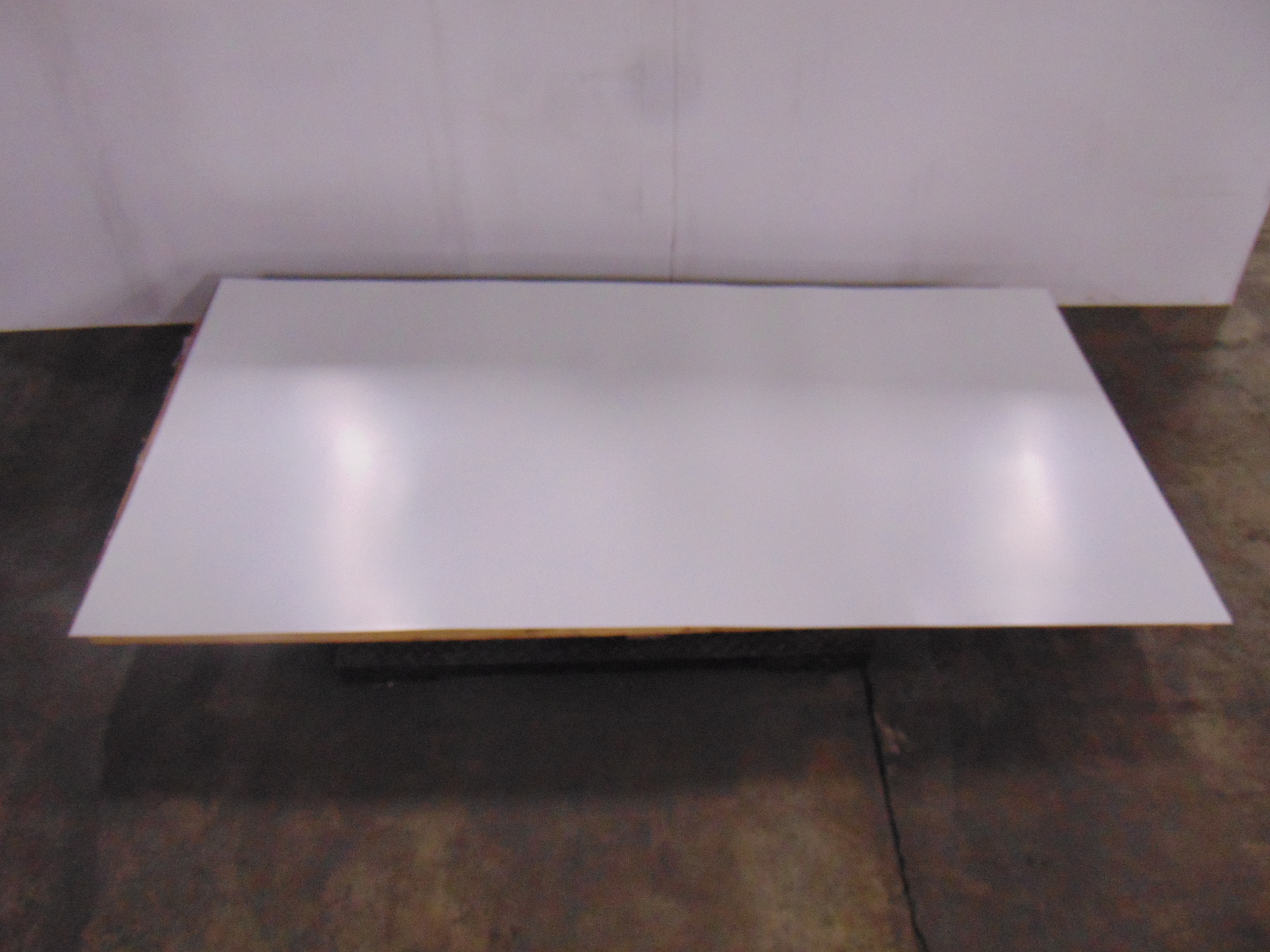 A sheet of white acrylic plexiglass