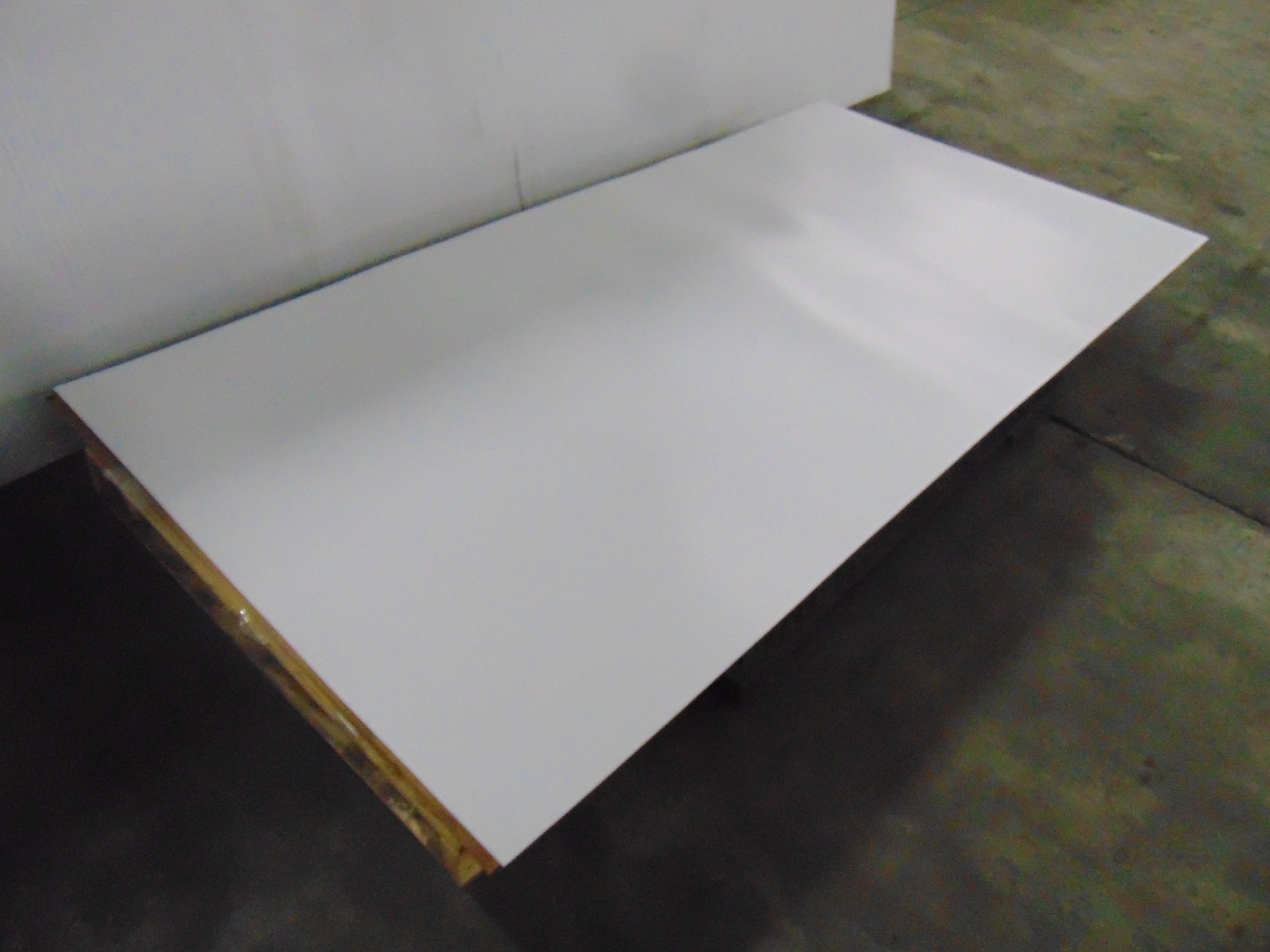 A sheet of white acrylic plexiglass