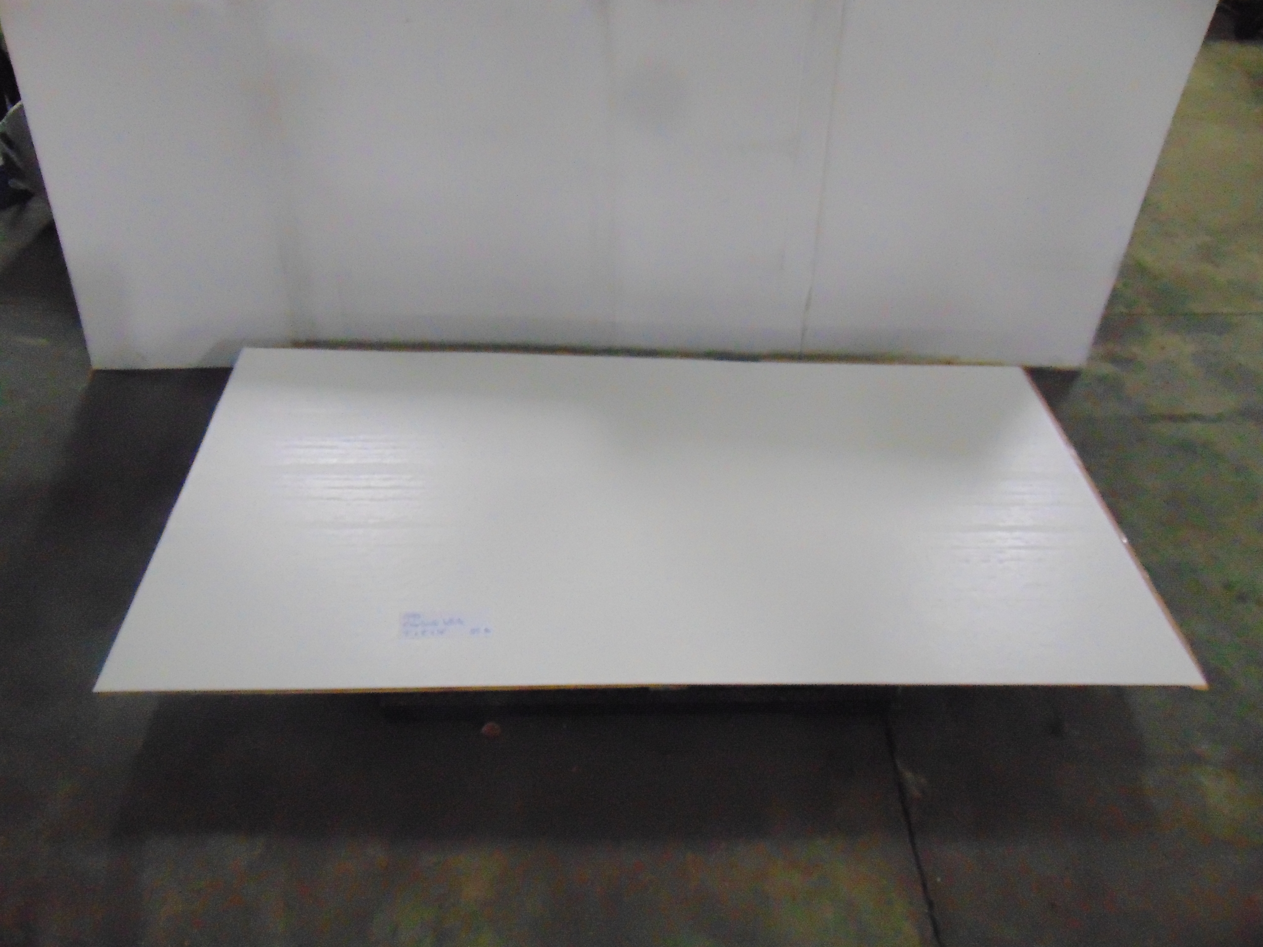 A sheet of white acrylic plexiglass