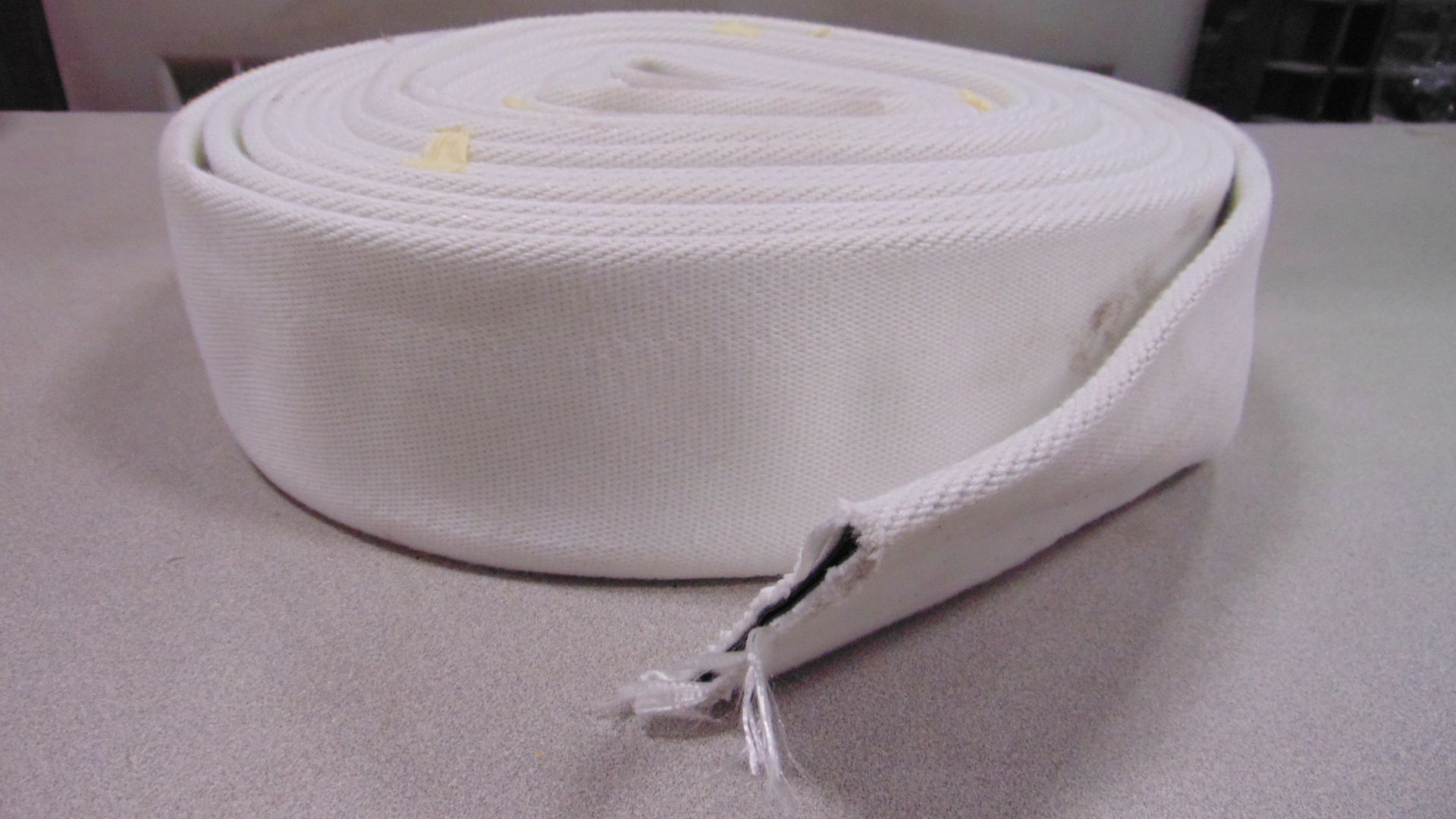 A white fire hose with no couplings