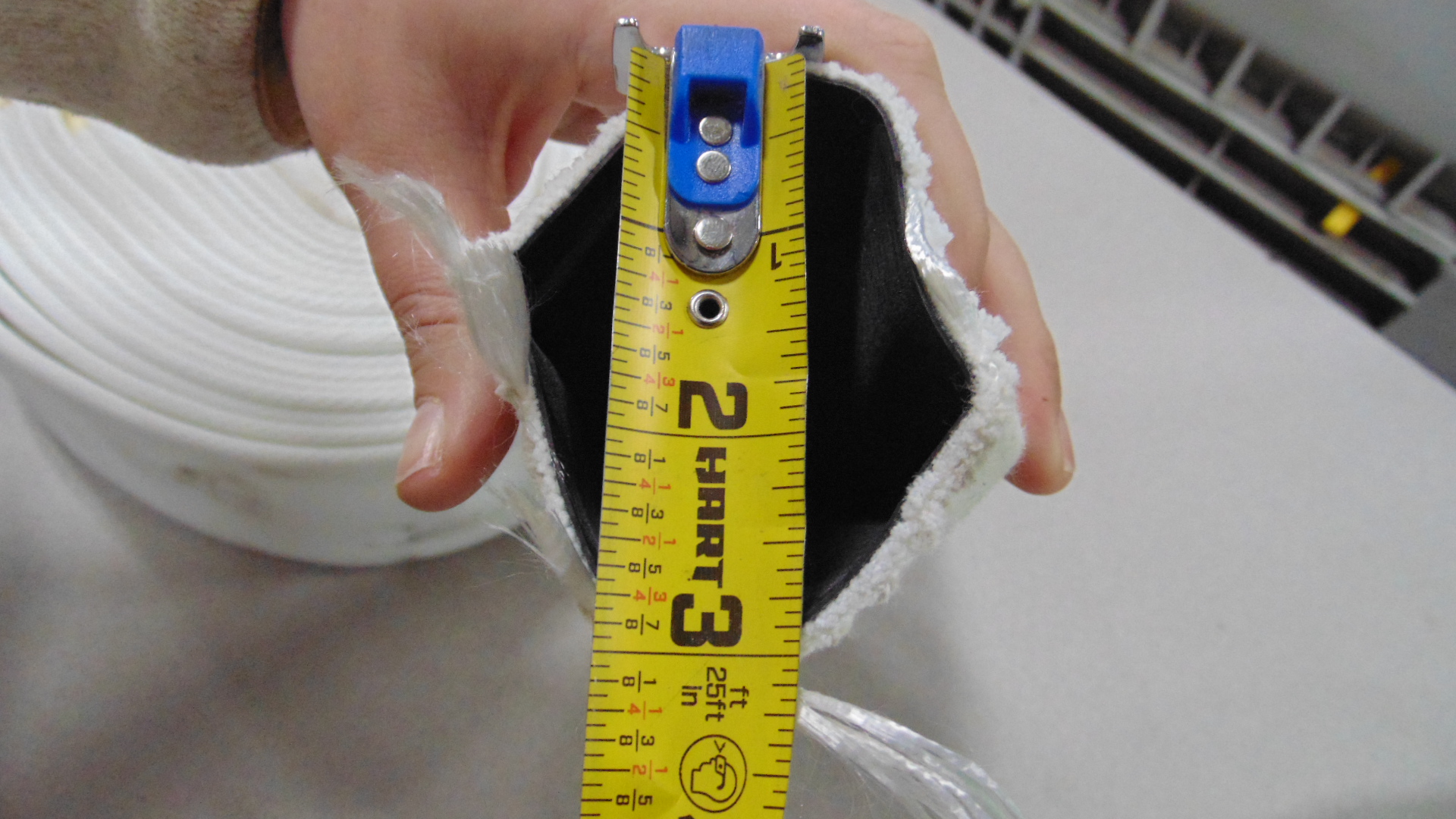 A white fire hose without couplings