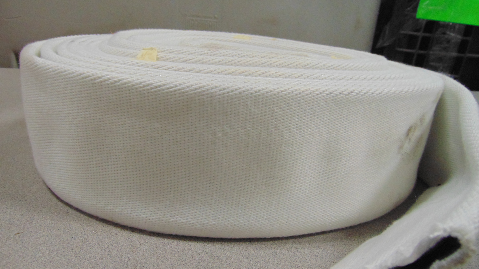 A white fire hose with no couplings