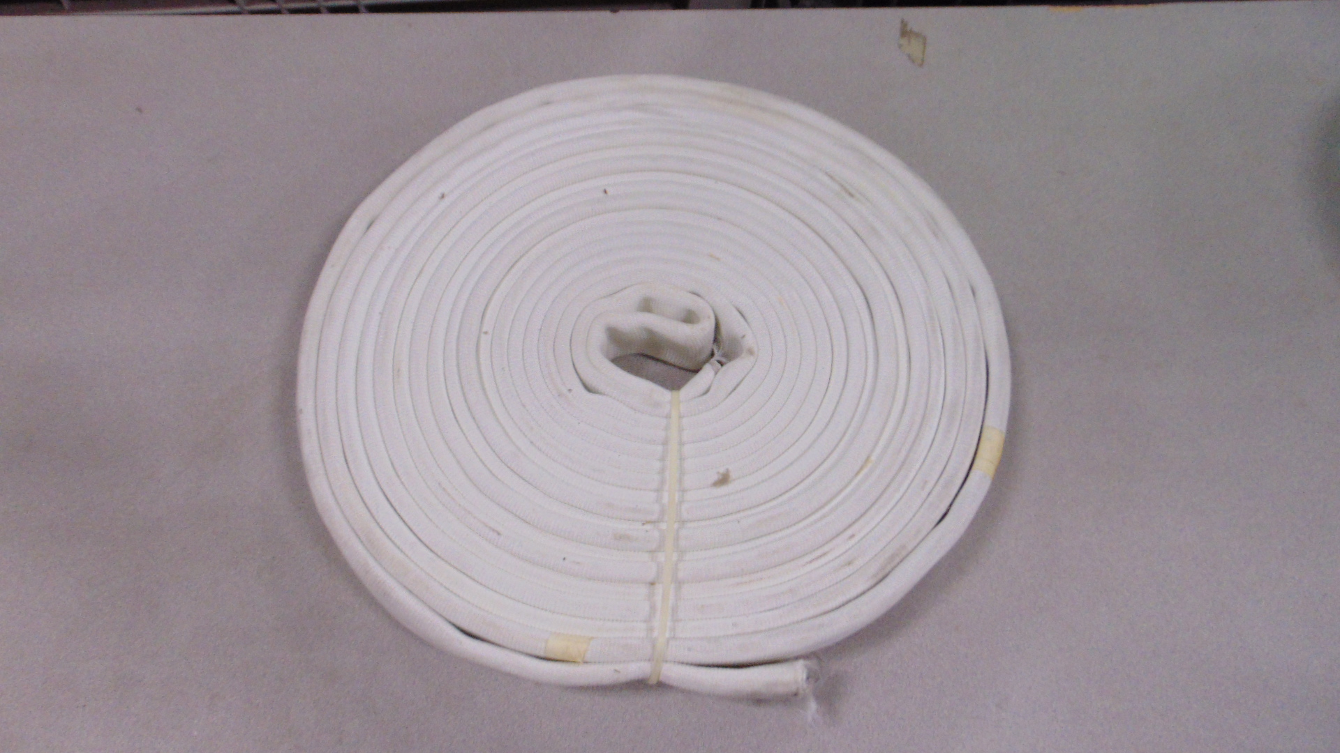 A white fire hose with no couplings