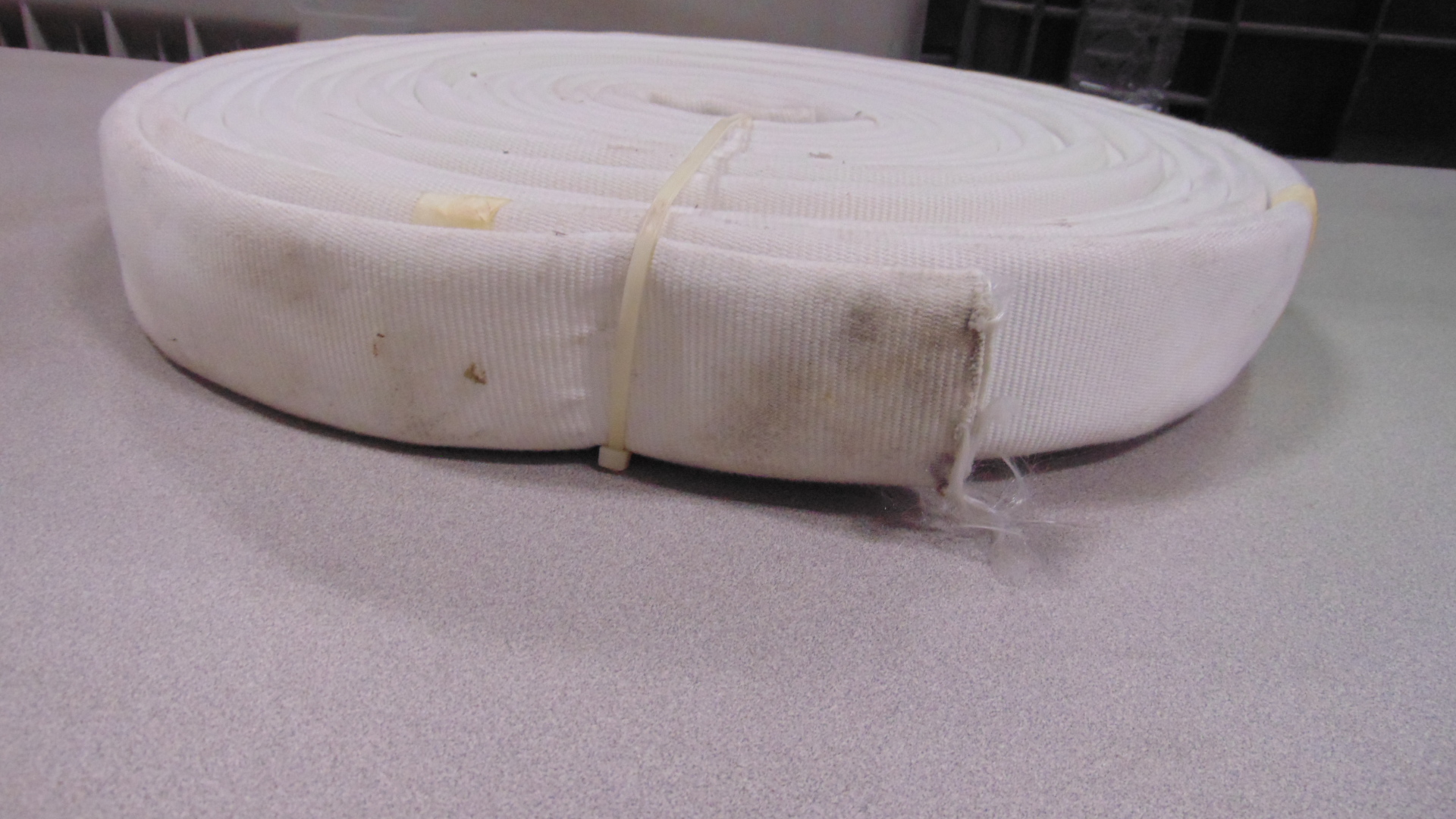 A white fire hose with no couplings