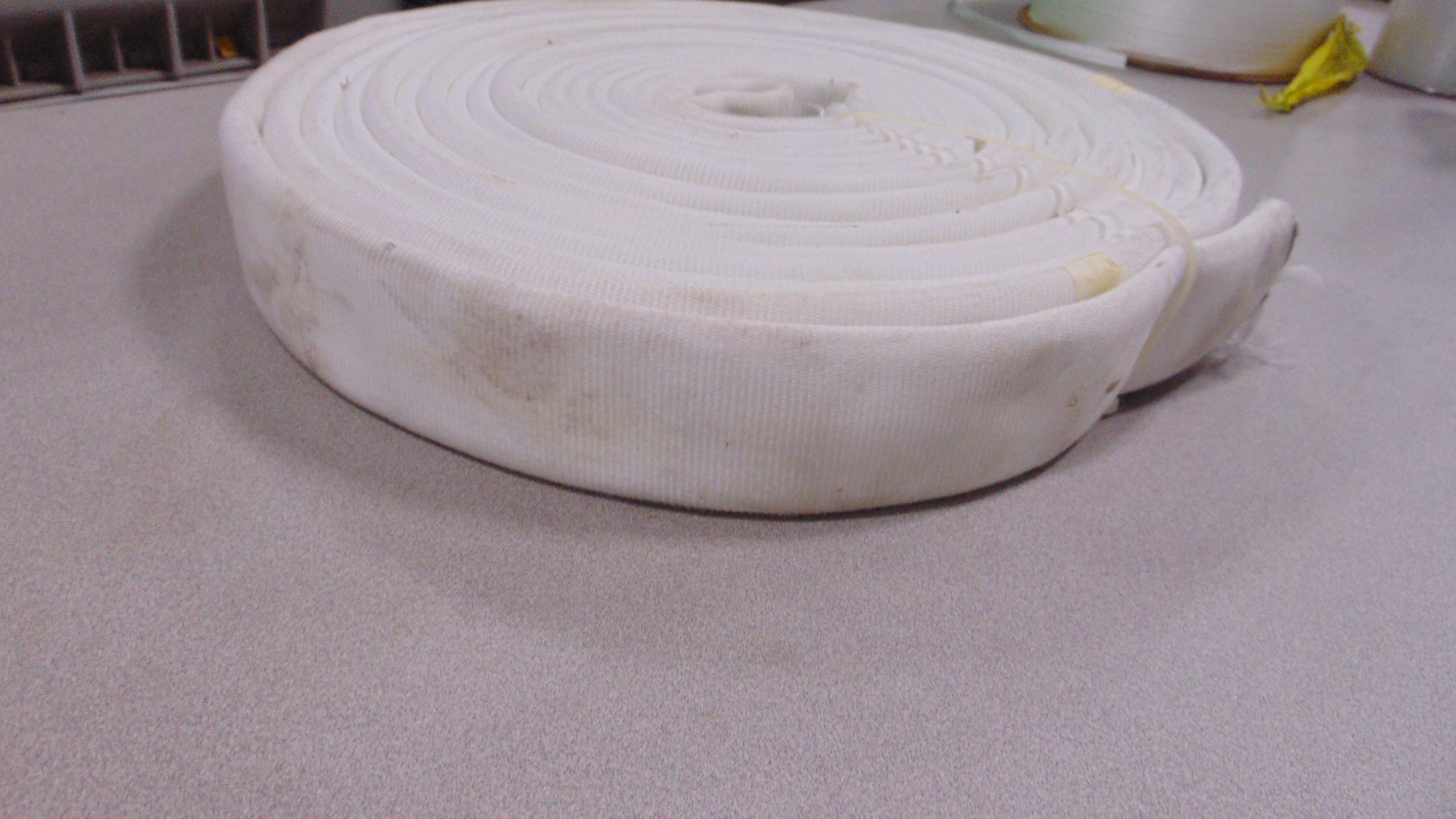 A white fire hose with no couplings