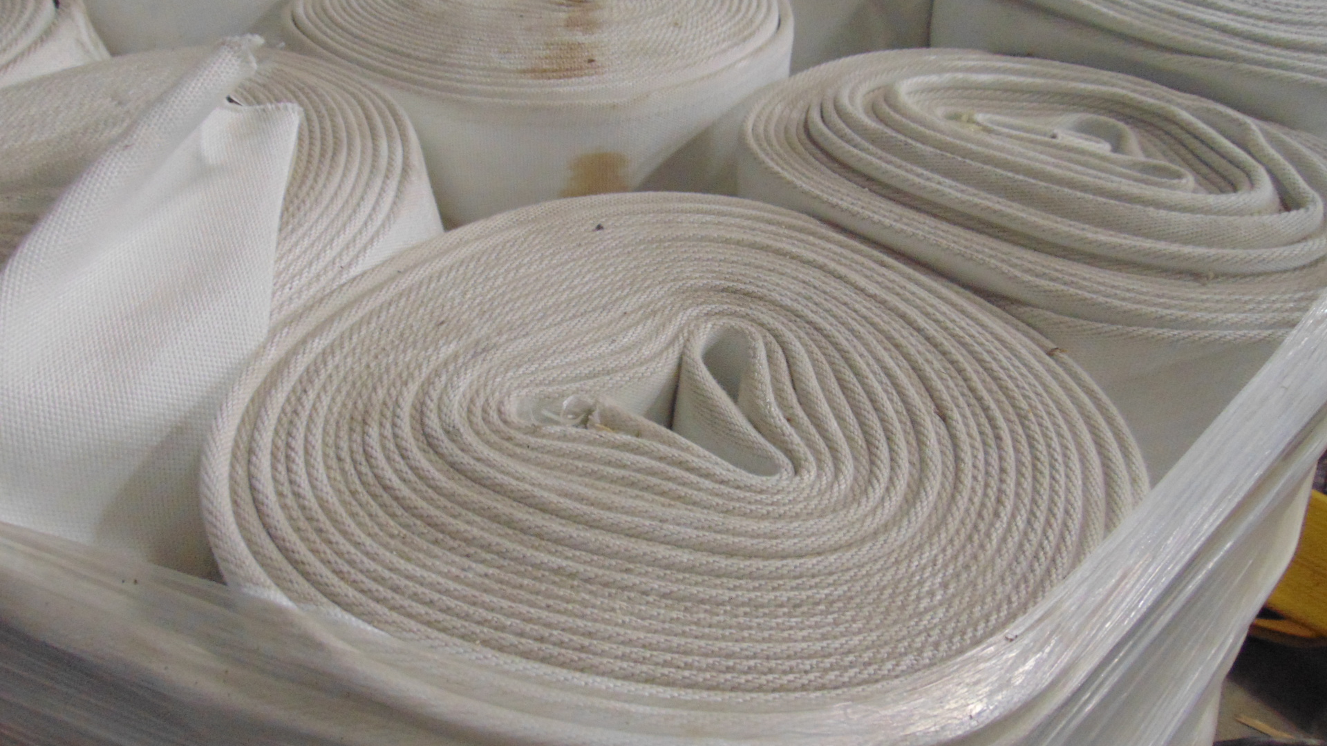 A white fire hose with no couplings