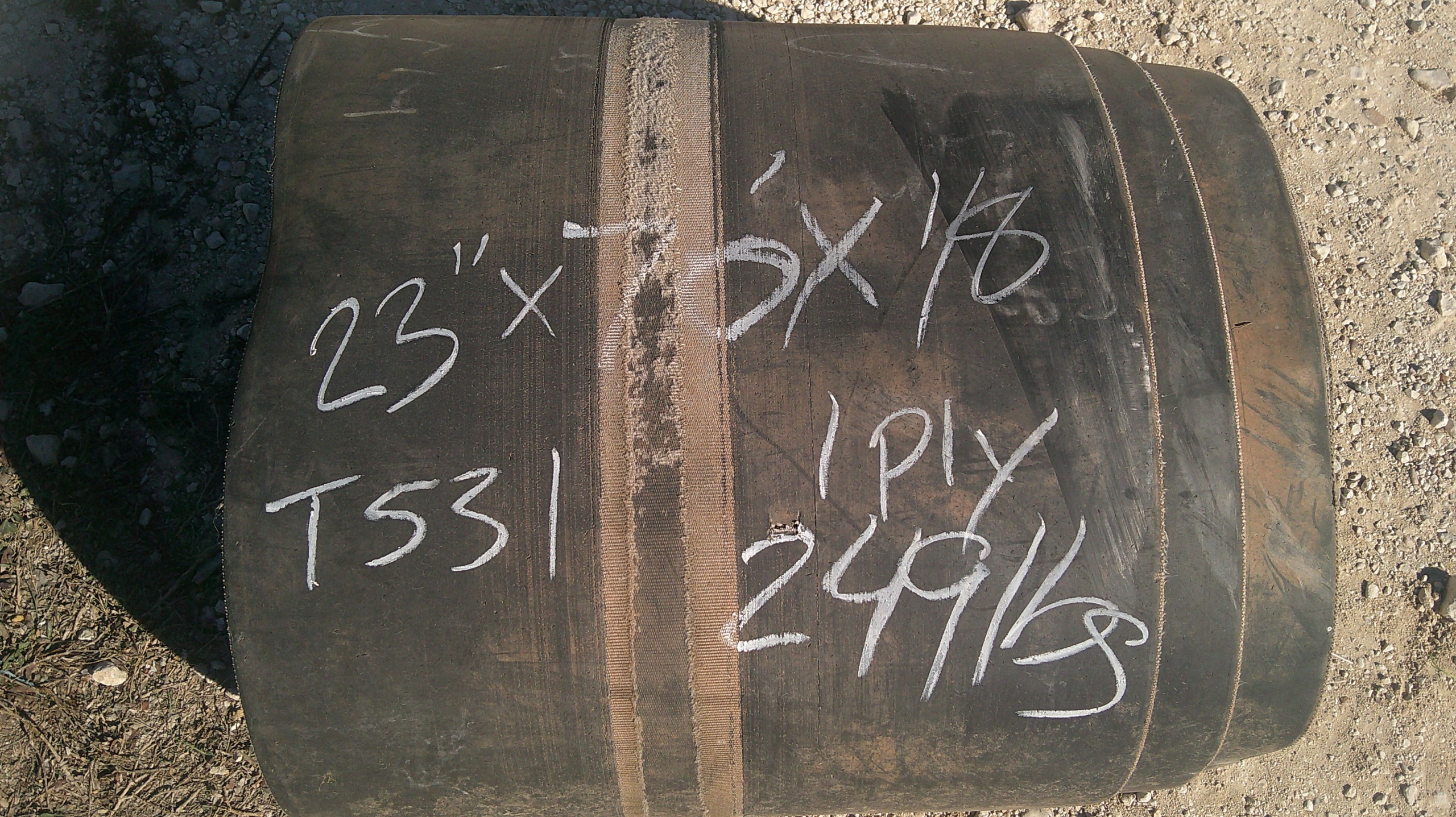 A roll of used rubber conveyor