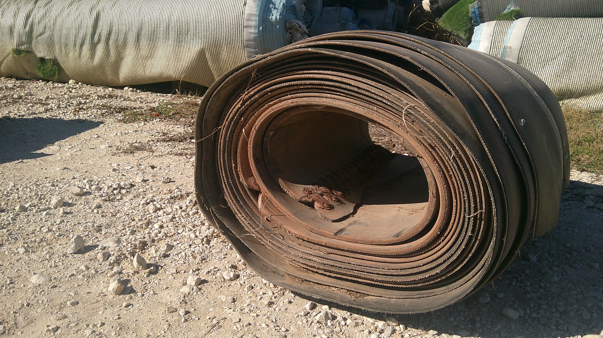 A roll of used rubber conveyor