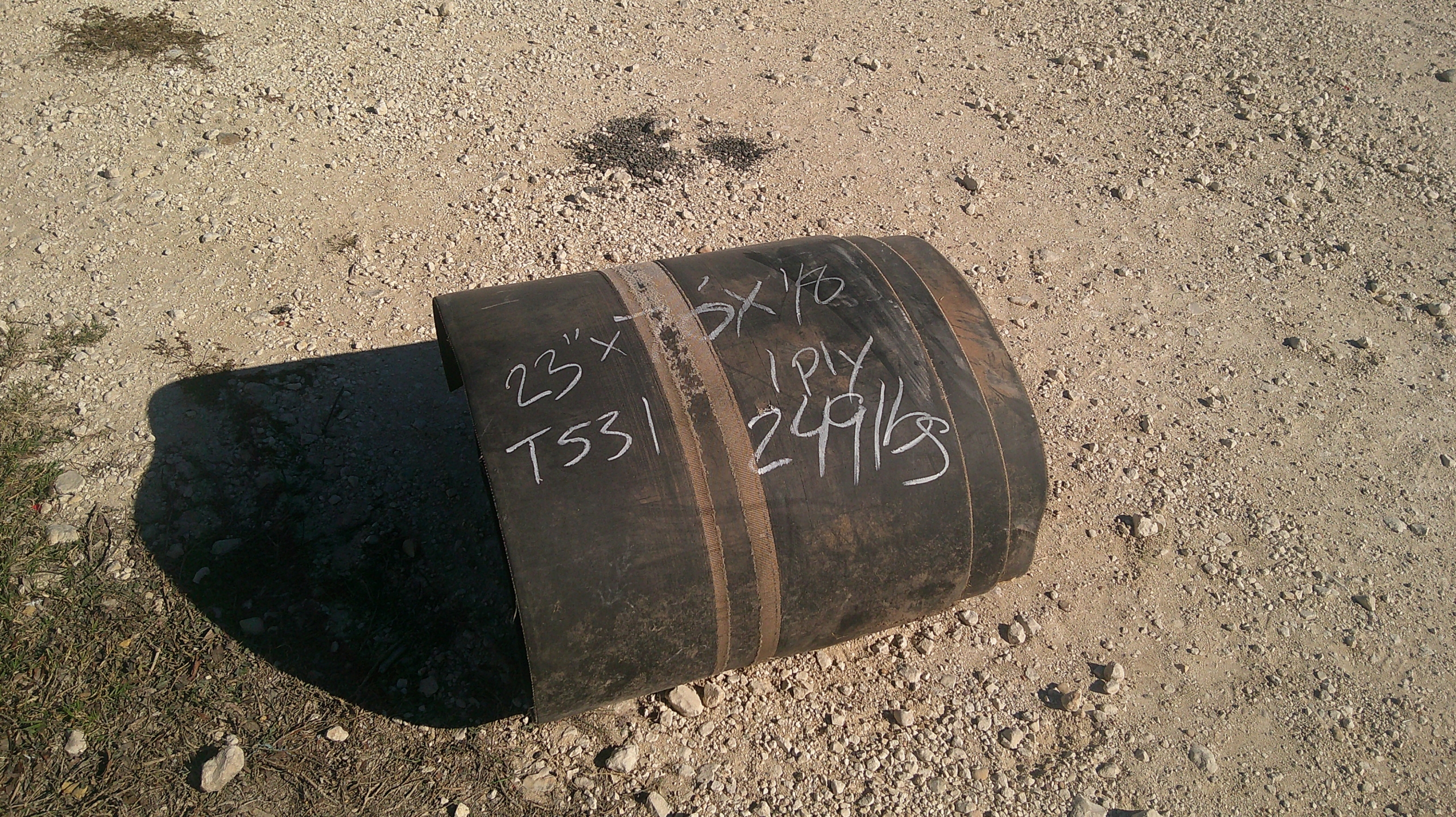 A roll of used rubber conveyor