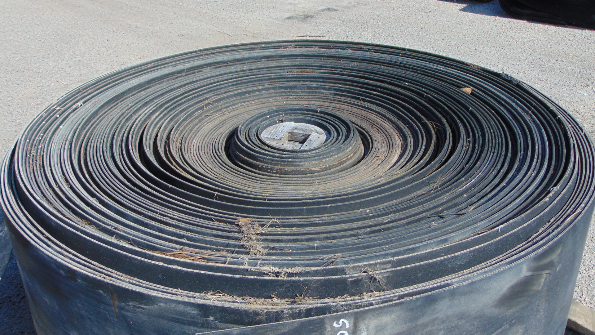 A roll of used rubber conveyor