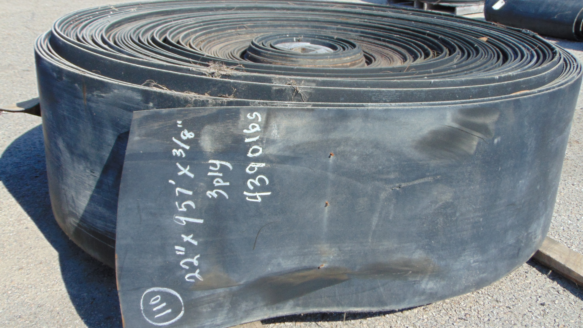 A roll of used rubber conveyor
