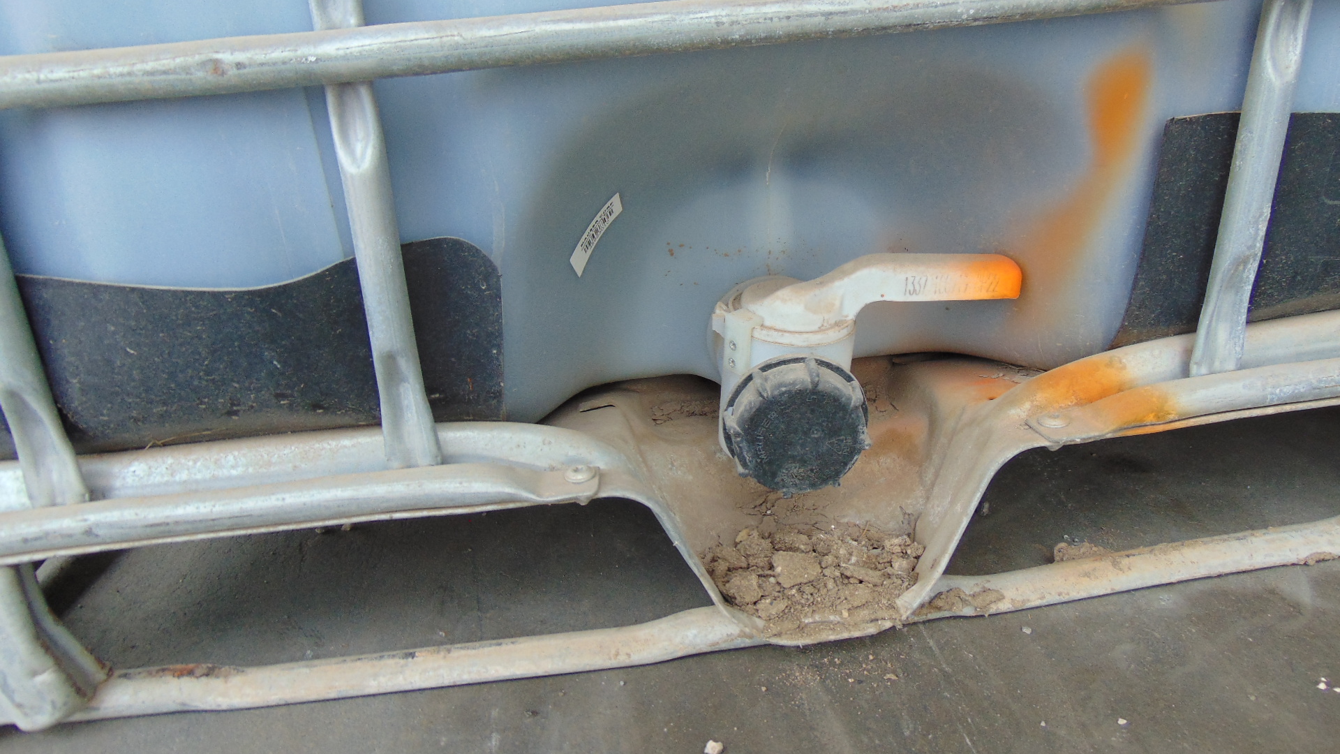 Container of Grind Aid