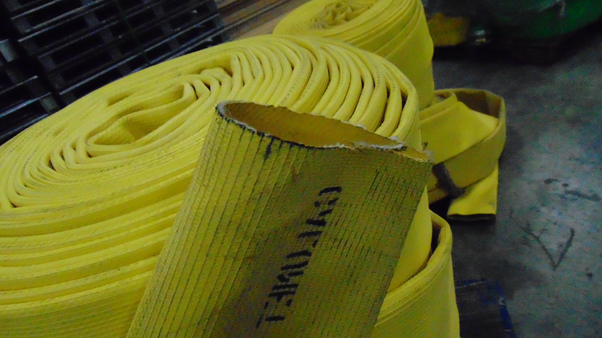 a yellow fire hose with no couplings