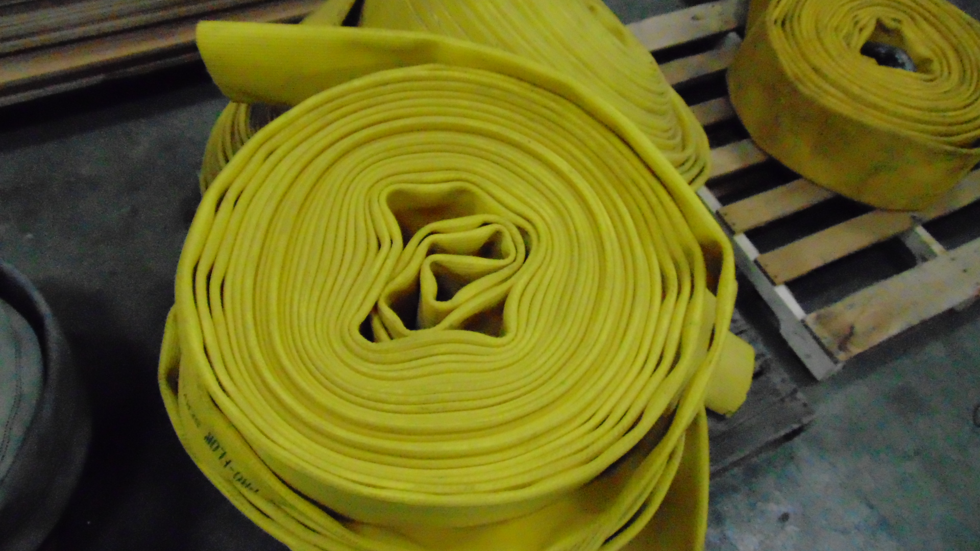 a yellow fire hose with no couplings