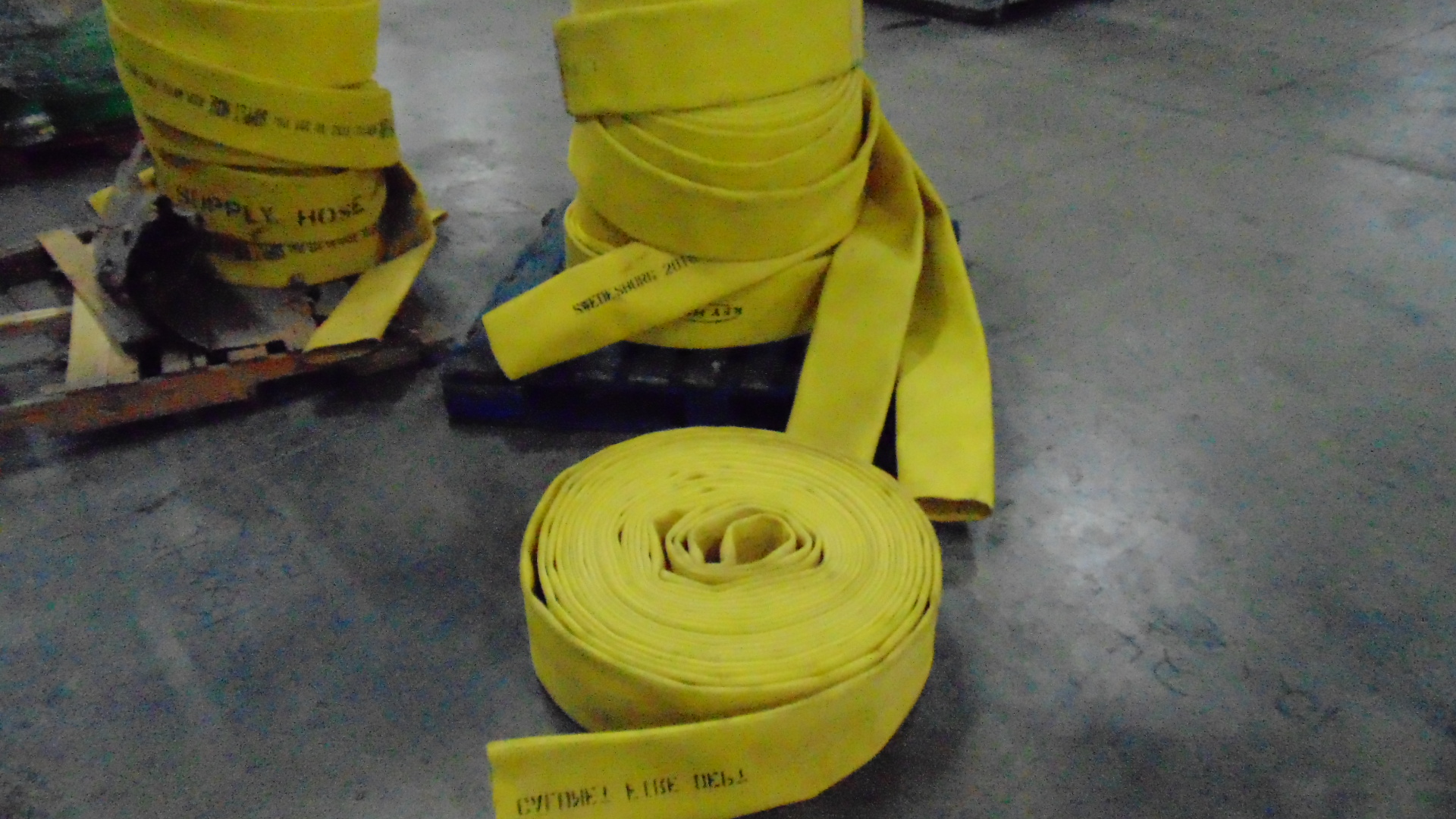 a yellow fire hose with no couplings