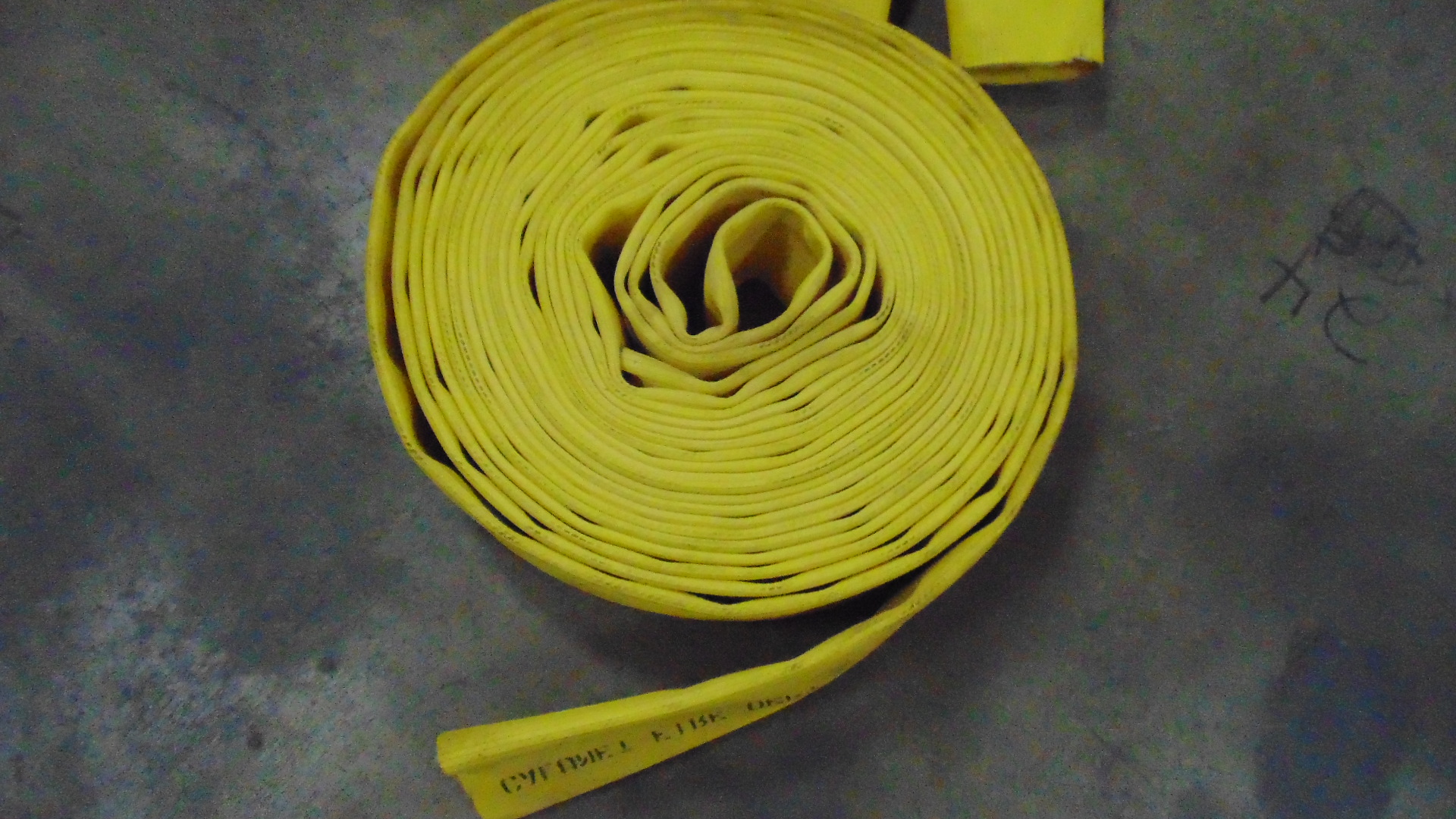 a yellow fire hose with no couplings