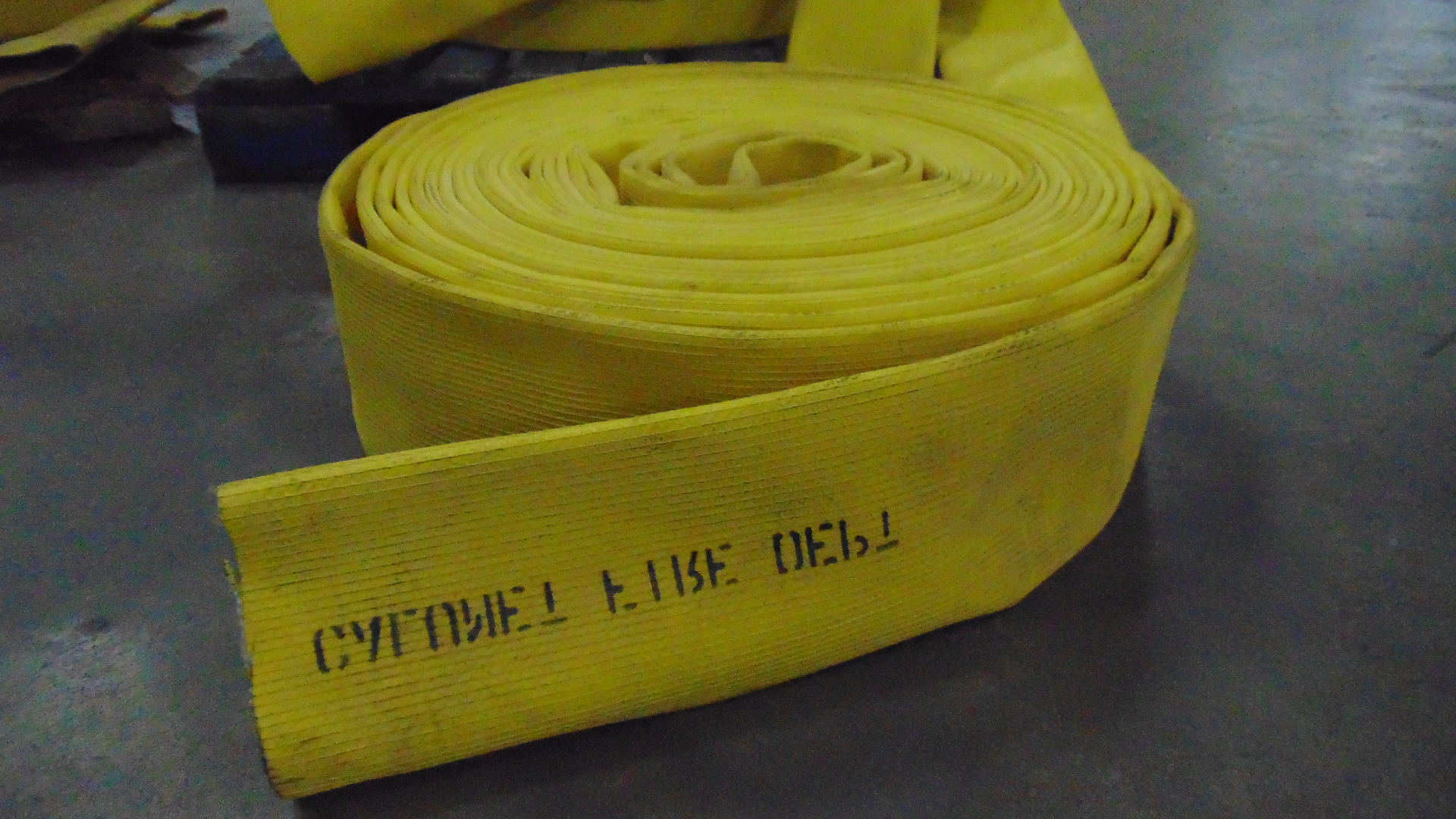 a yellow fire hose with no couplings