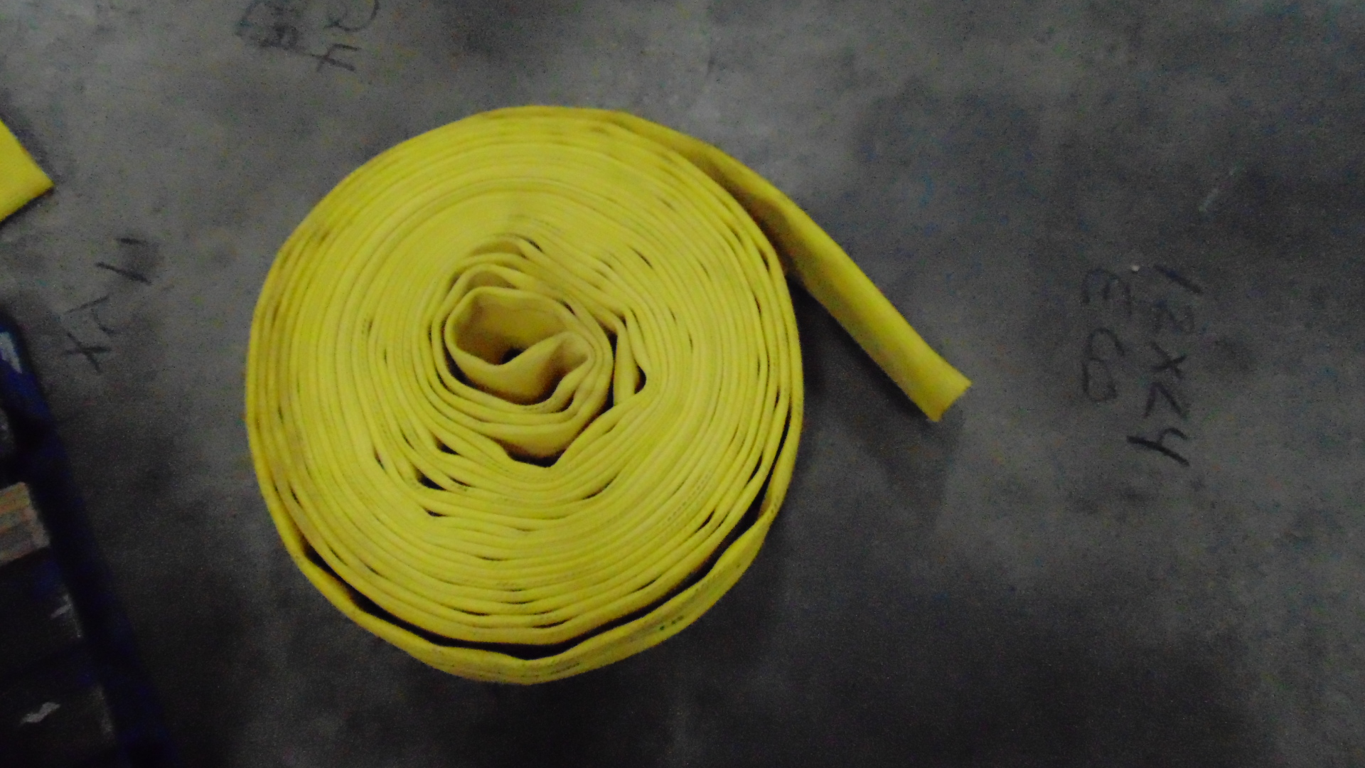 a yellow fire hose with no couplings