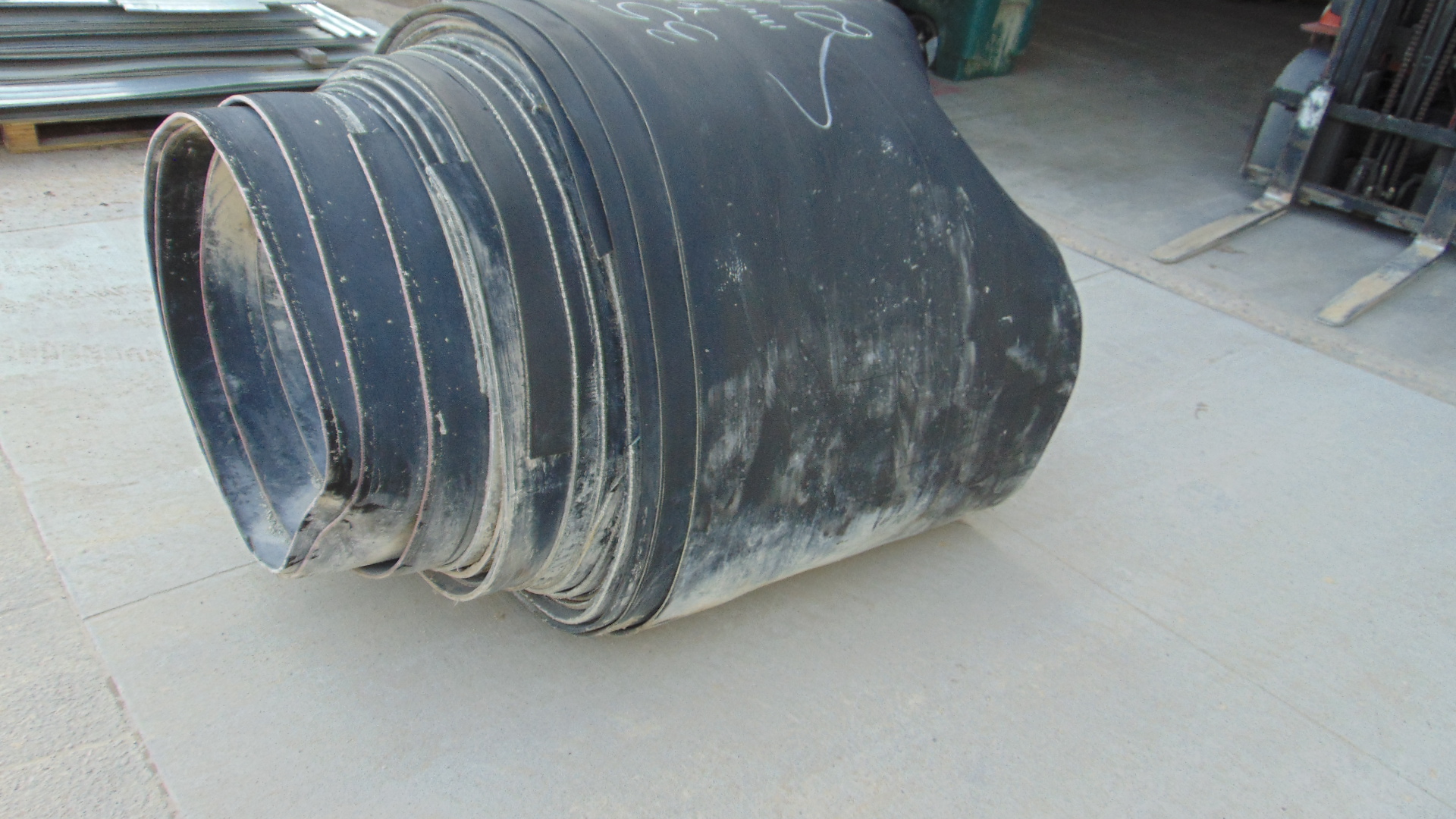 A roll of used rubber conveyor