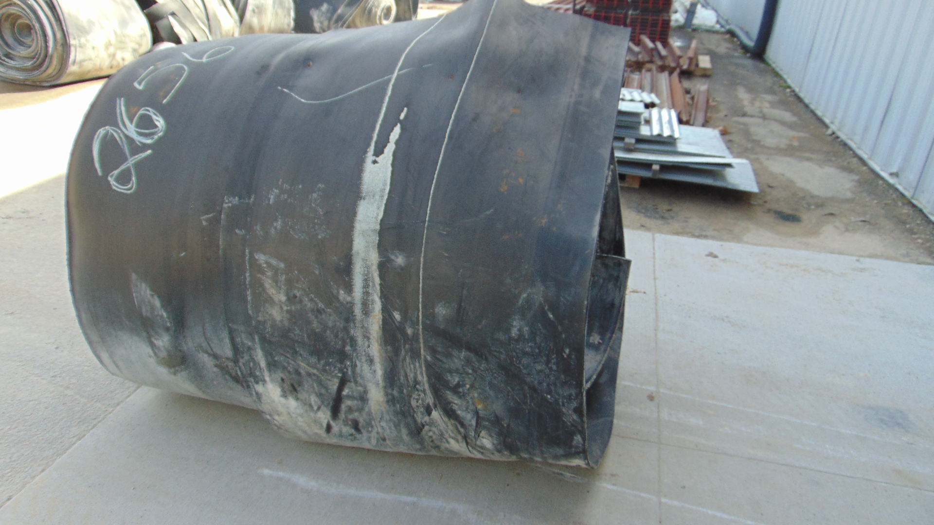 A roll of used rubber conveyor