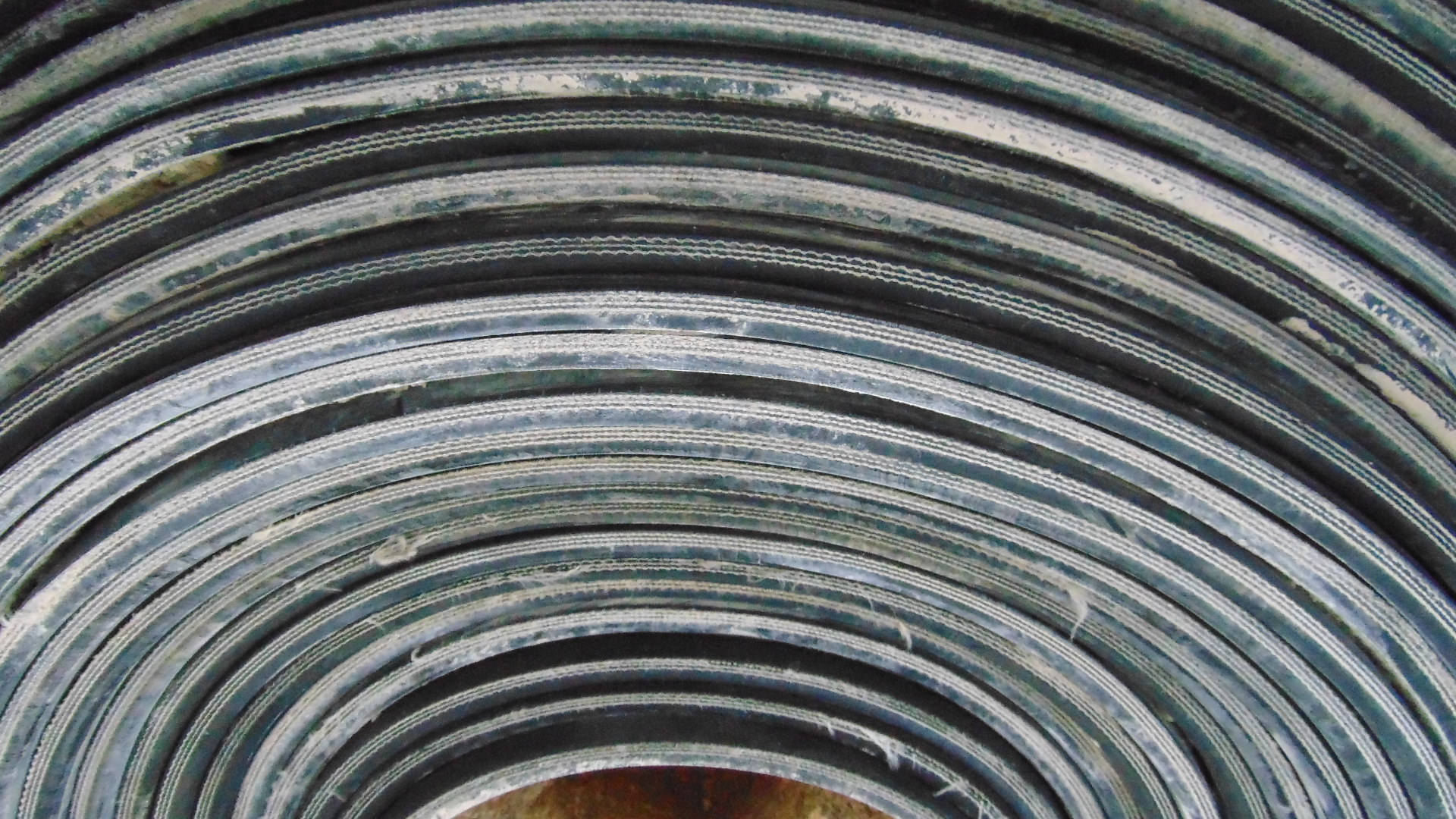 A roll of used rubber conveyor
