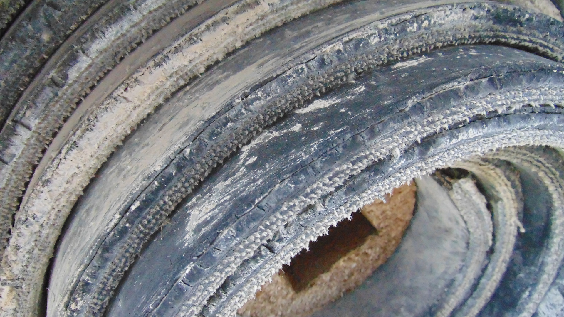 A roll of used rubber conveyor