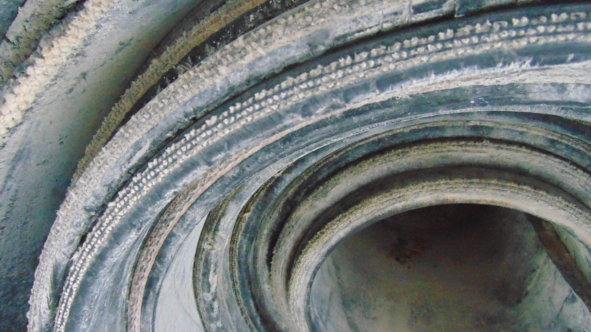 A roll of used rubber conveyor