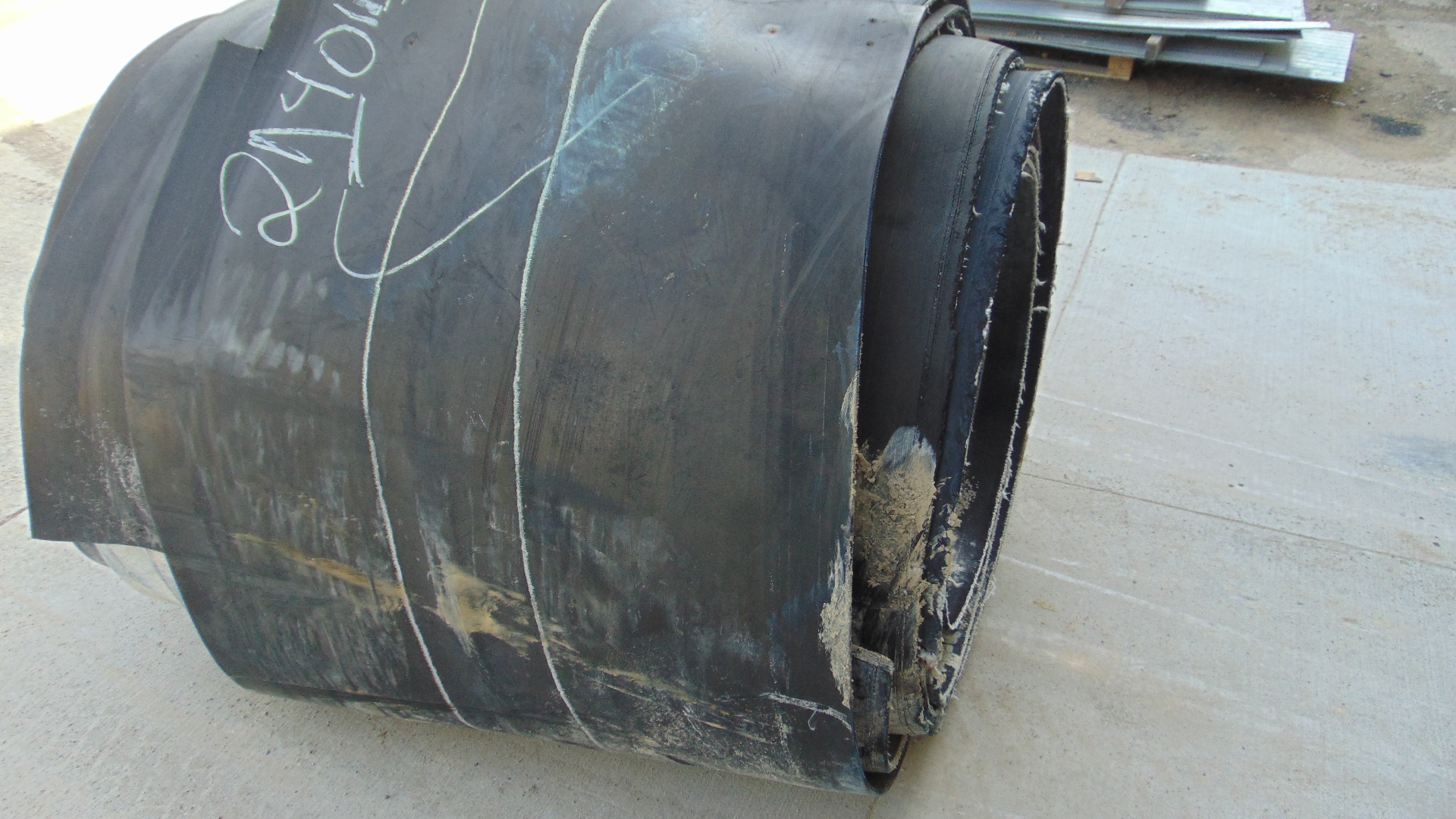 A roll of used rubber conveyor