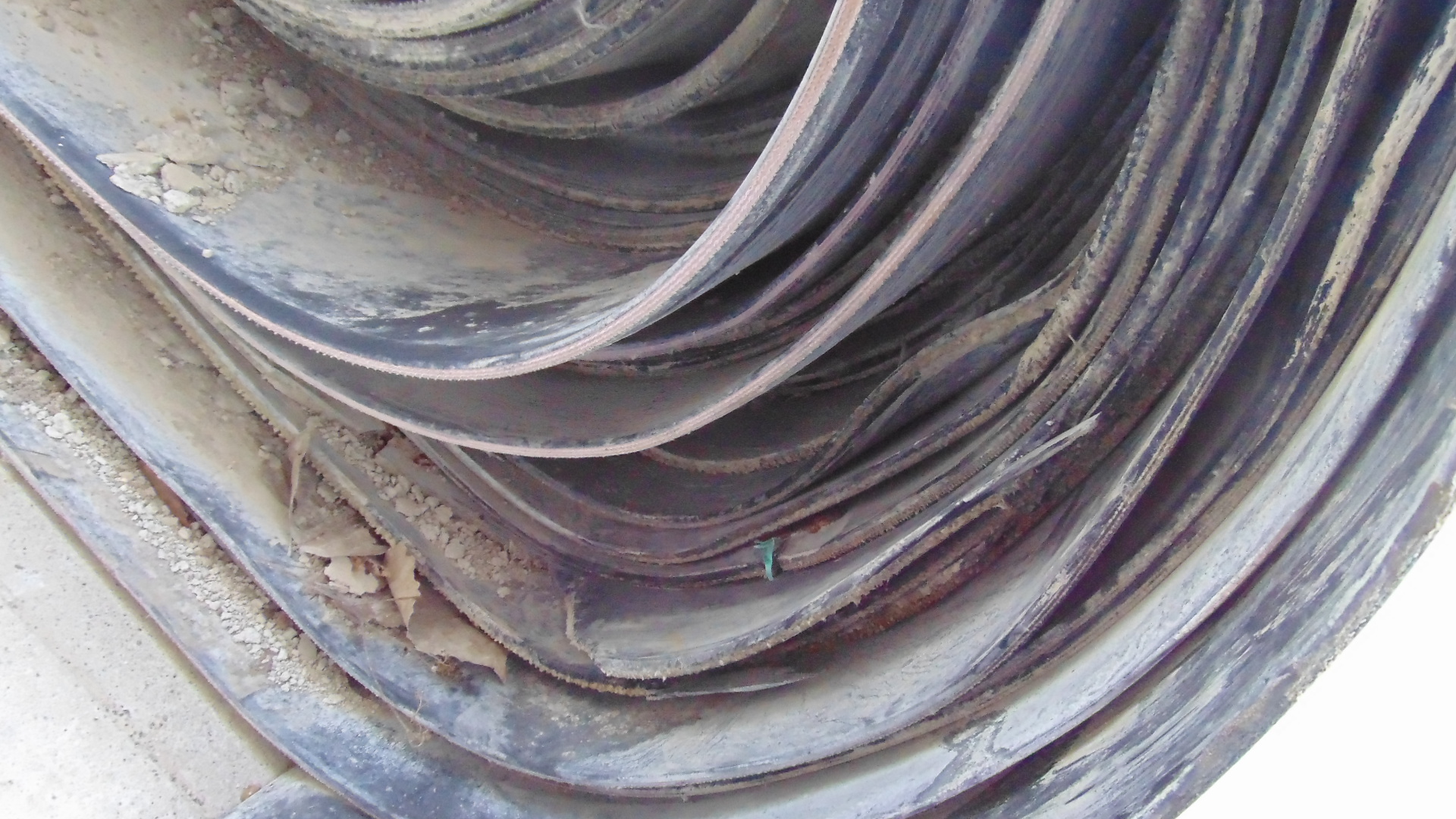 A roll of used rubber conveyor