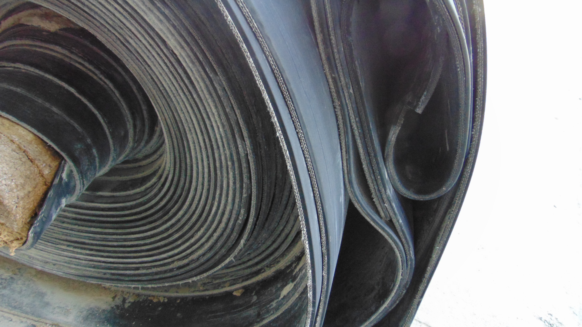 A roll of used rubber conveyor