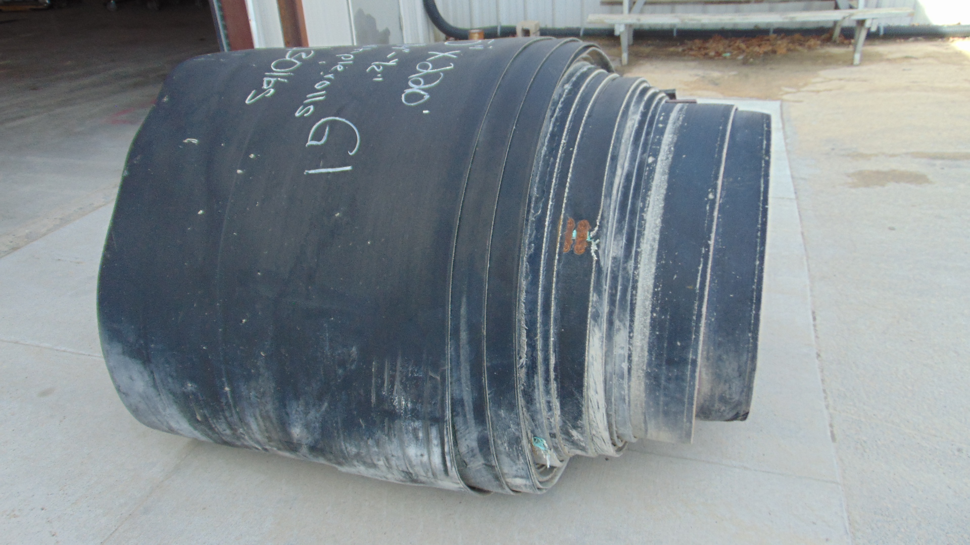 A roll of used rubber conveyor