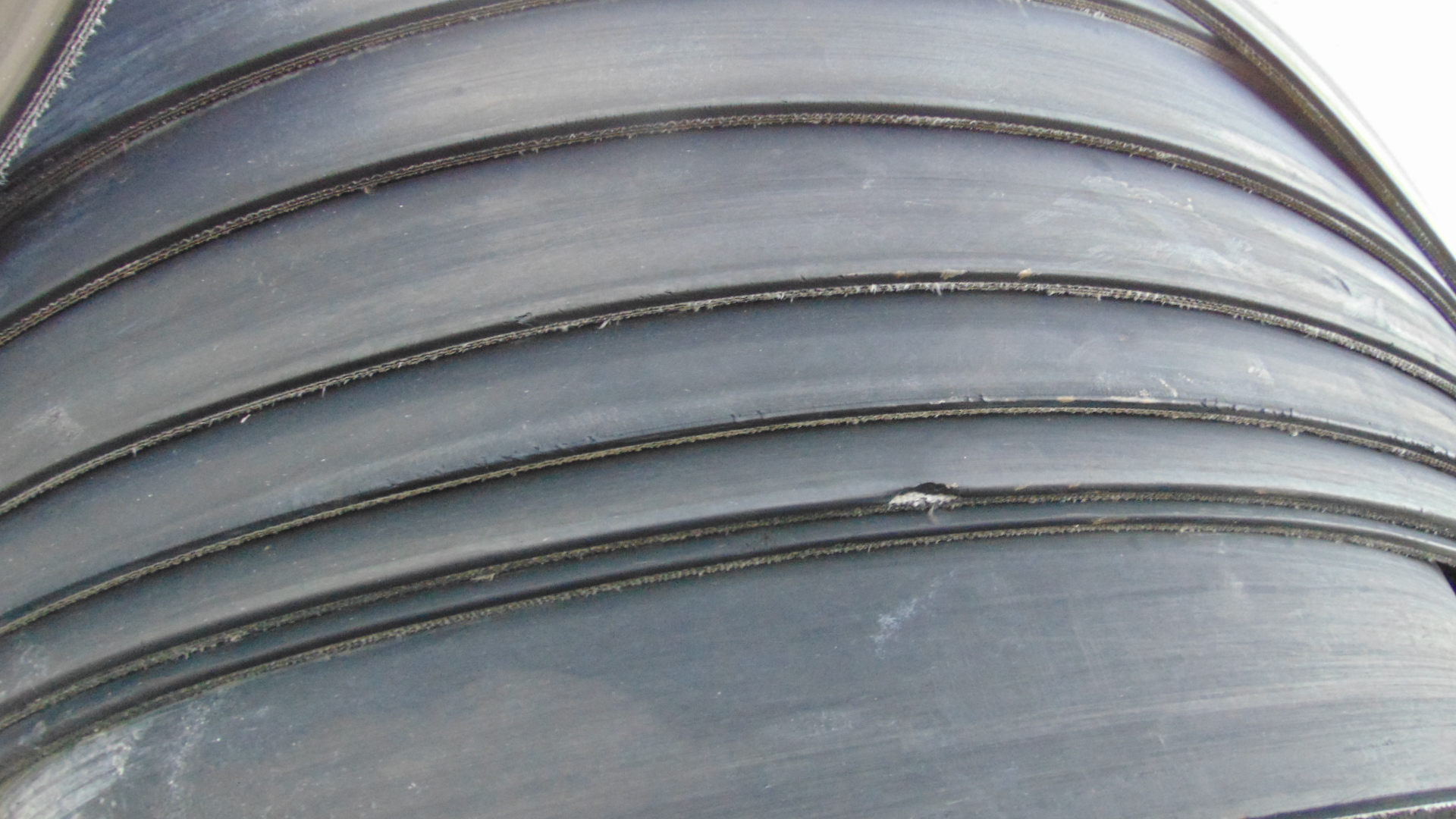 A roll of used rubber conveyor