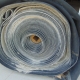 Conveyor 47" x 300' x 3/8" - 3ply - Spliced A roll of used rubber conveyor