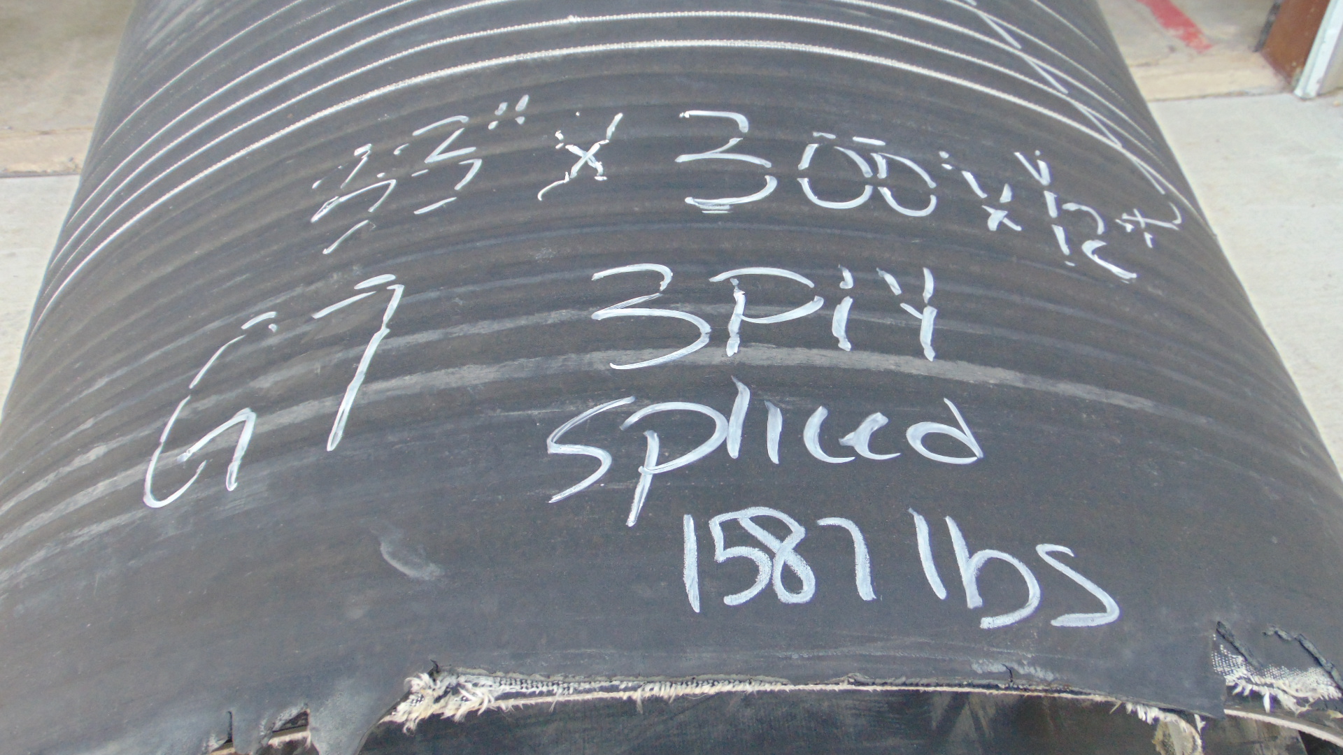 A roll of used rubber conveyor