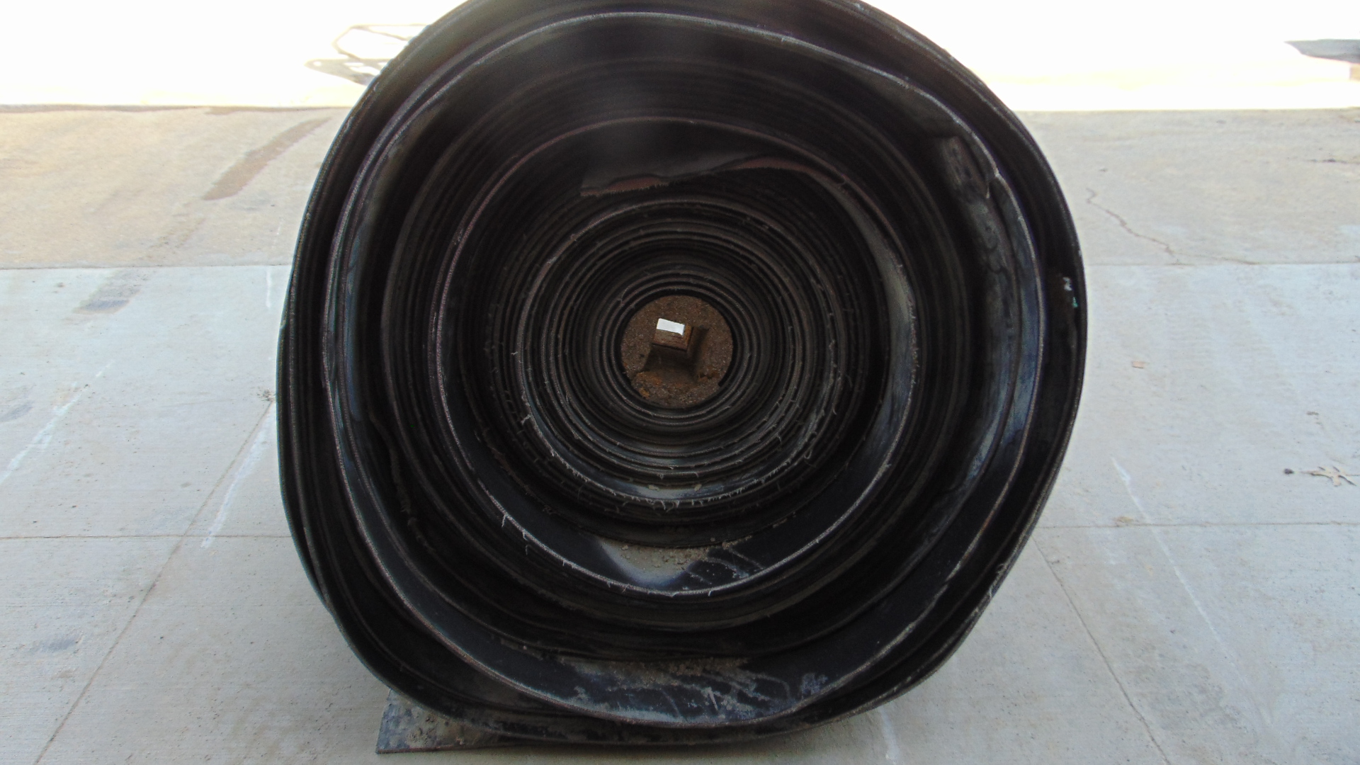 A roll of used rubber conveyor