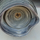 A roll of used rubber conveyor
