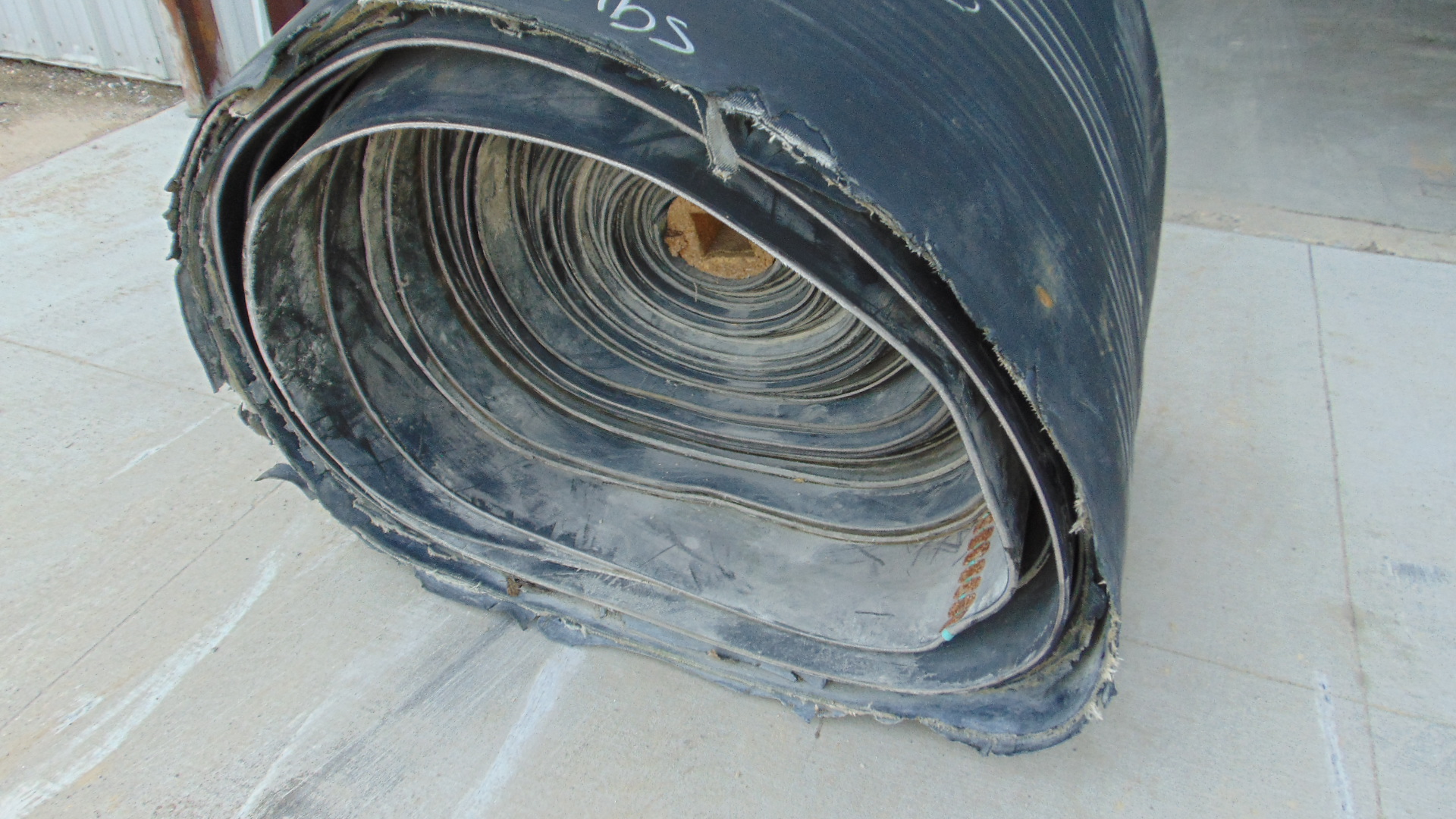 A roll of used rubber conveyor
