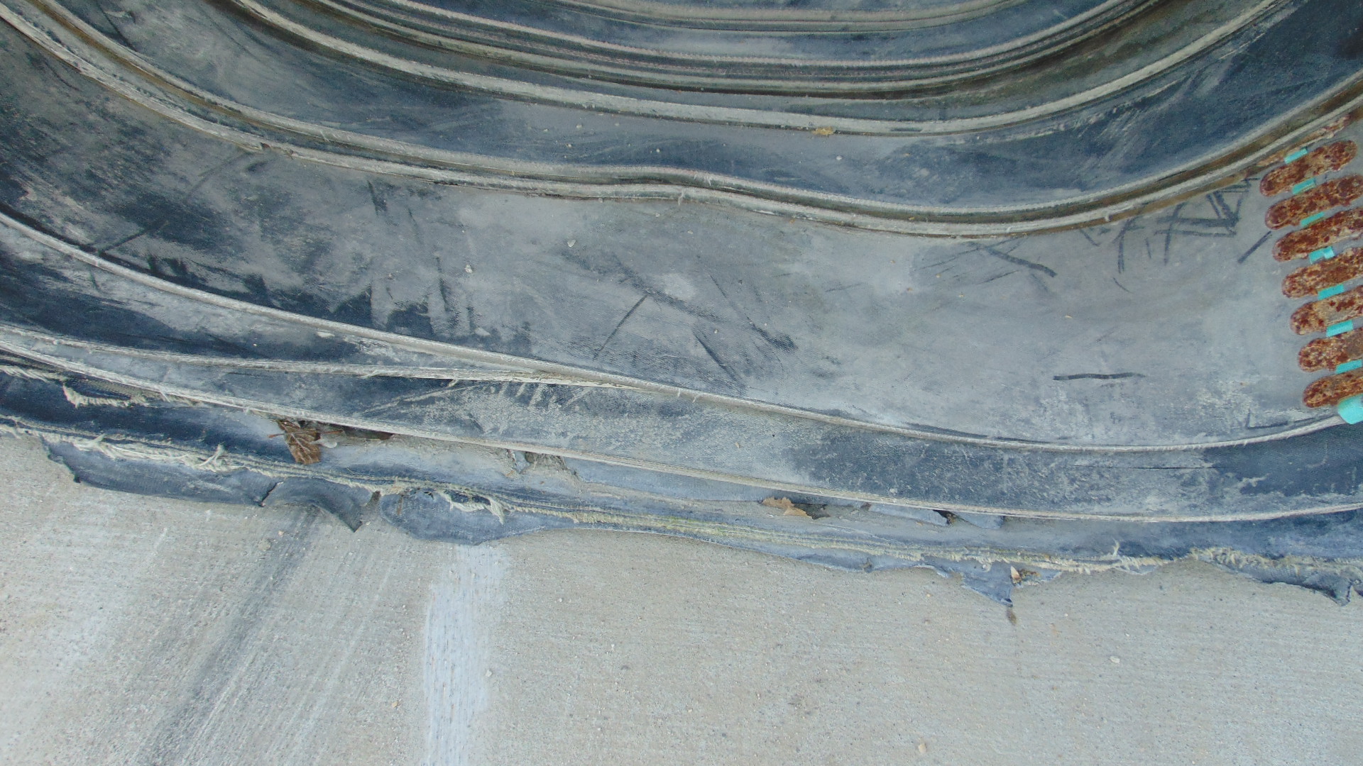 A roll of used rubber conveyor