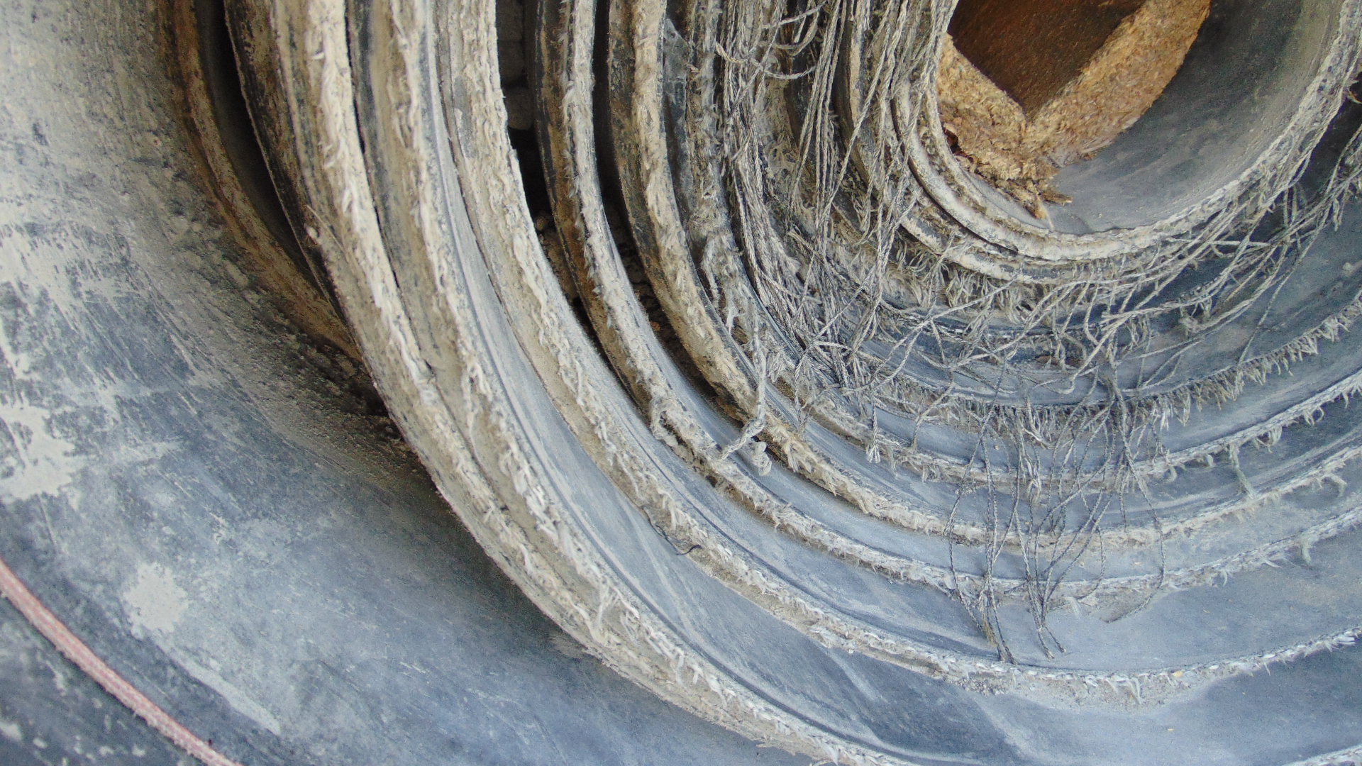 A roll of used rubber conveyor