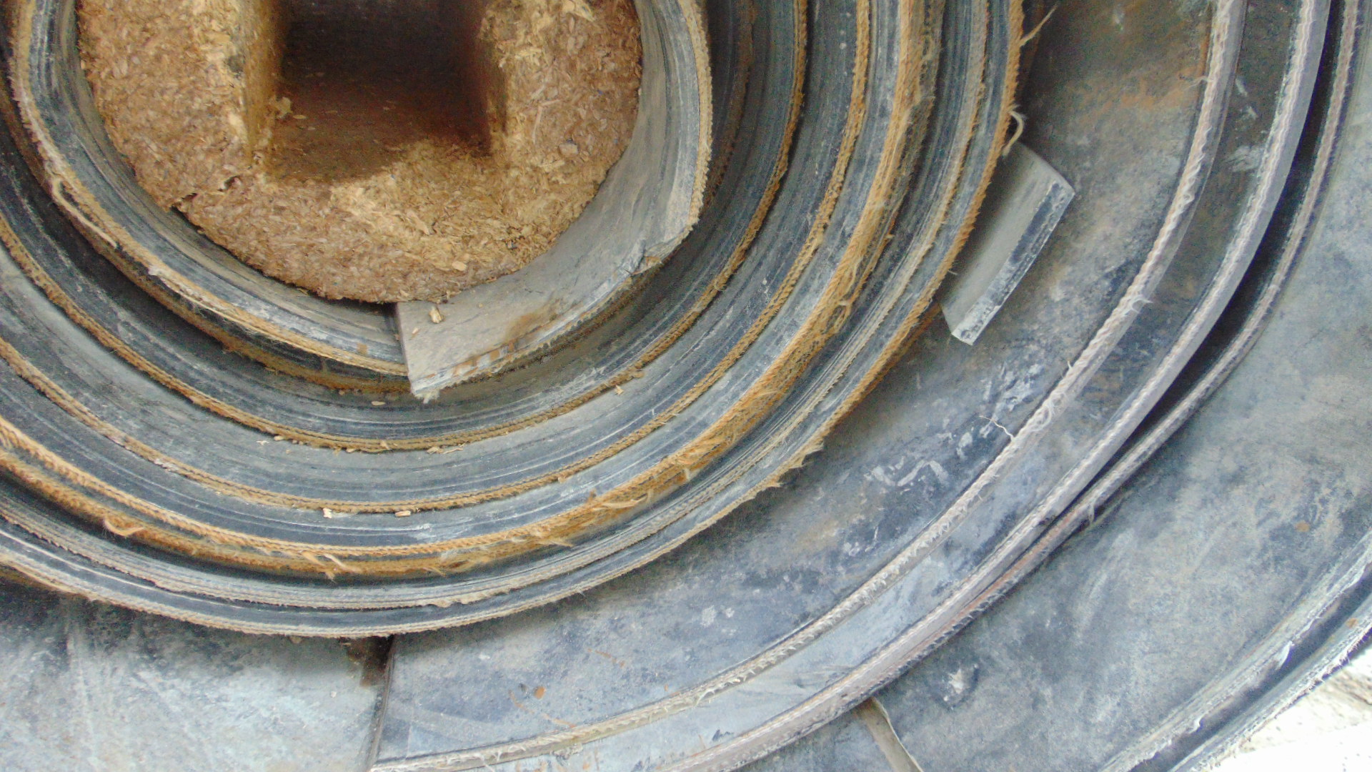A roll of used rubber conveyor