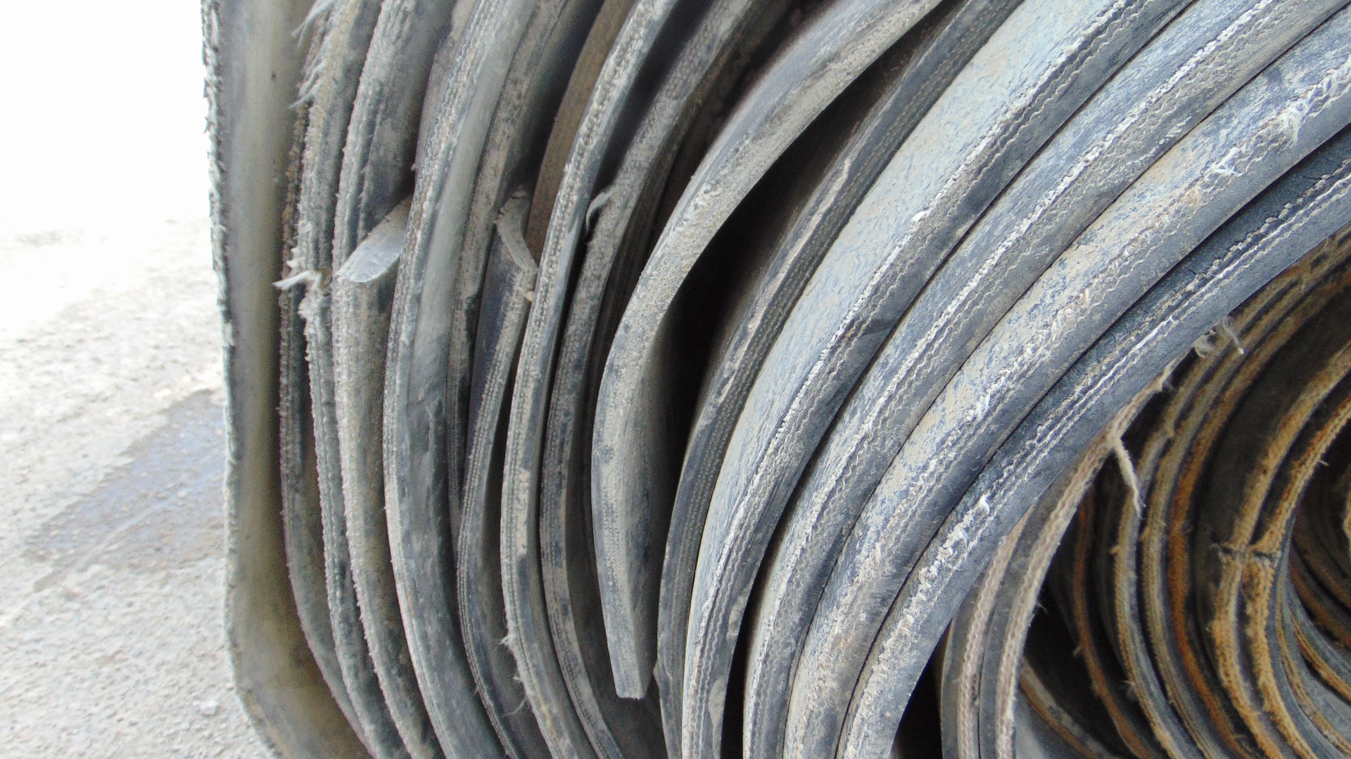 A roll of used rubber conveyor