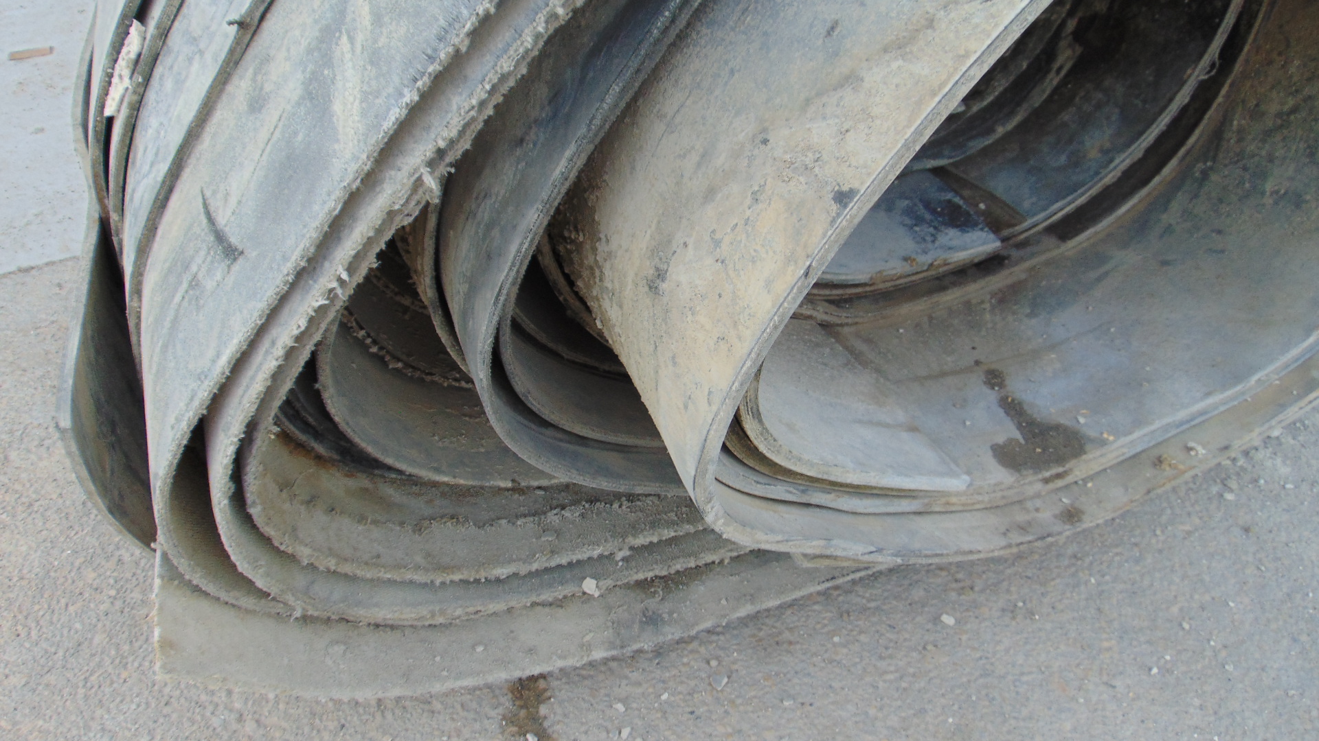 A roll of used rubber conveyor