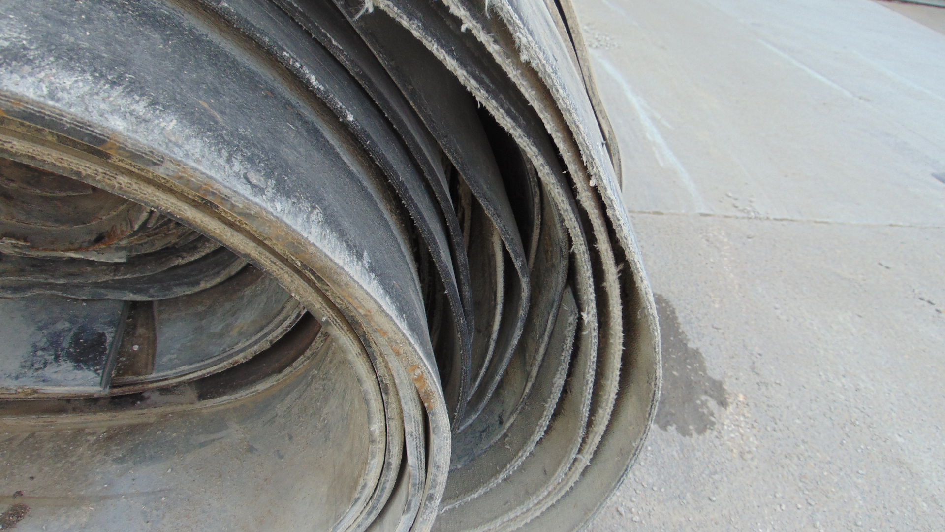 A roll of used rubber conveyor