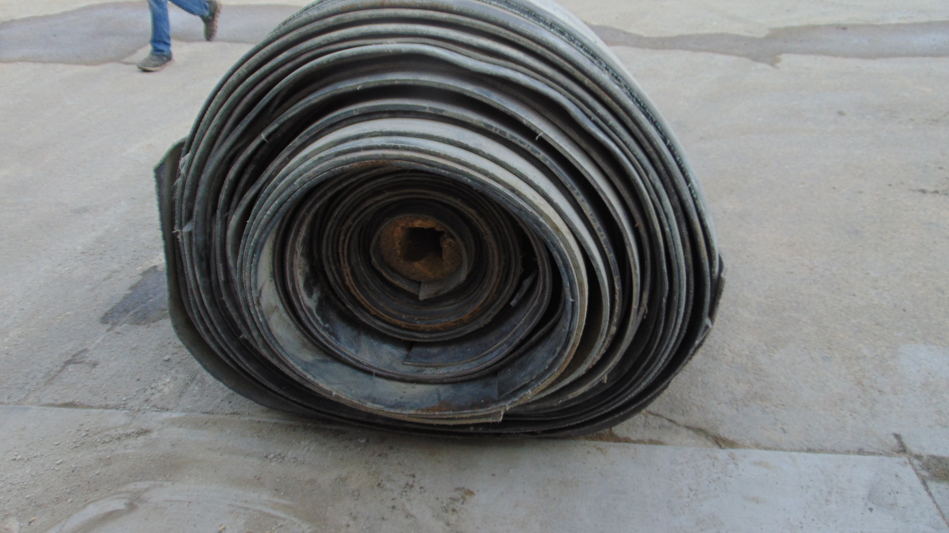 A roll of used rubber conveyor