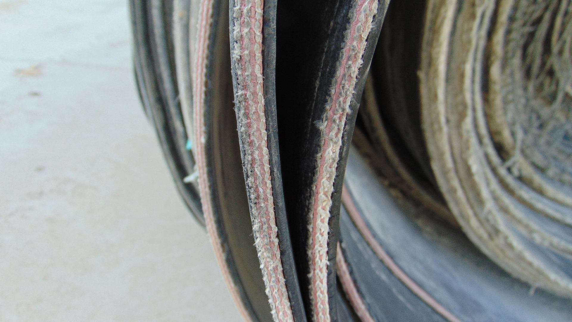 A roll of used rubber conveyor