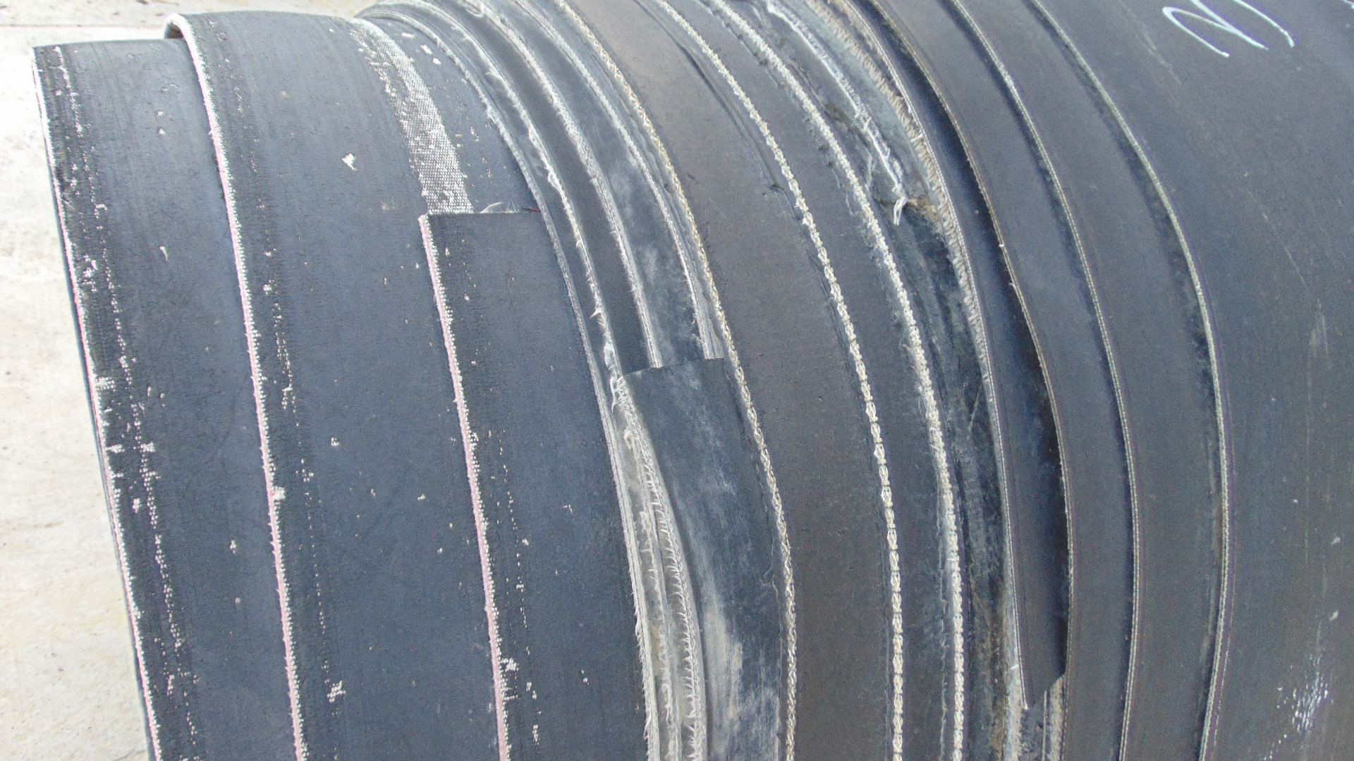 A roll of used rubber conveyor