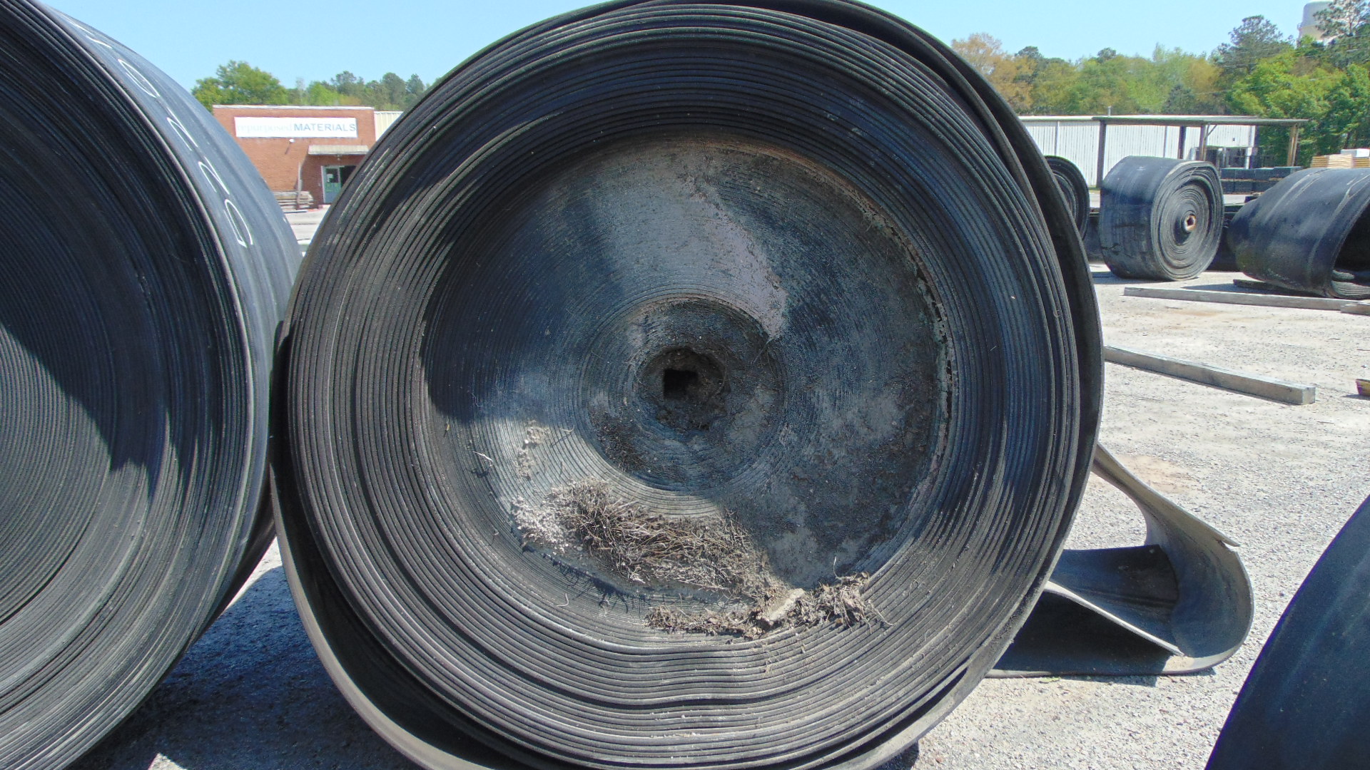 A roll of used rubber conveyor