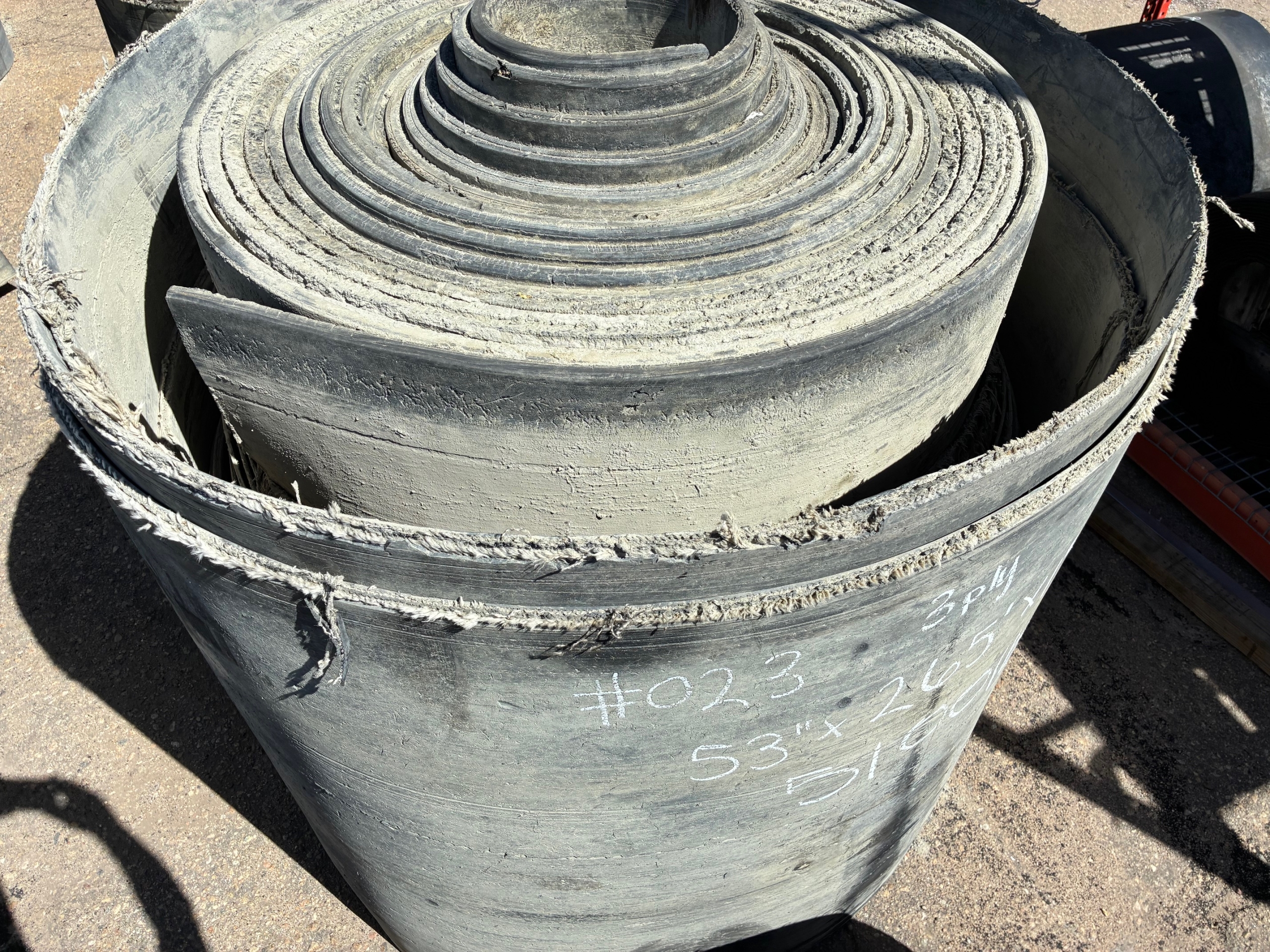A roll of used rubber conveyor