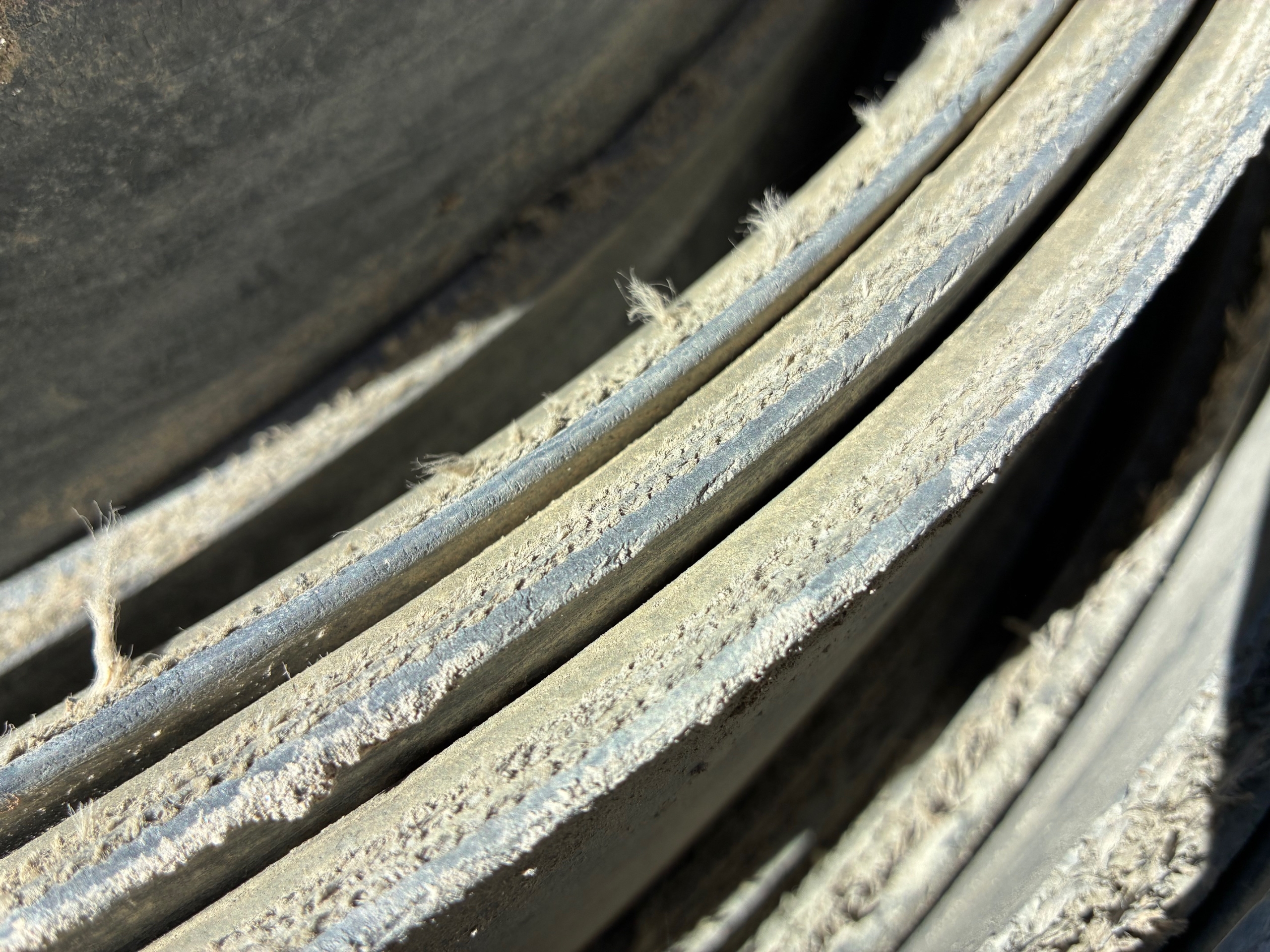 A roll of used rubber conveyor