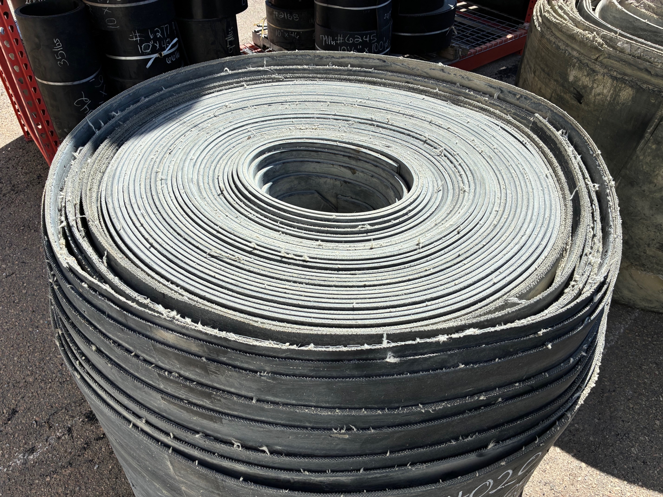 A roll of used rubber conveyor